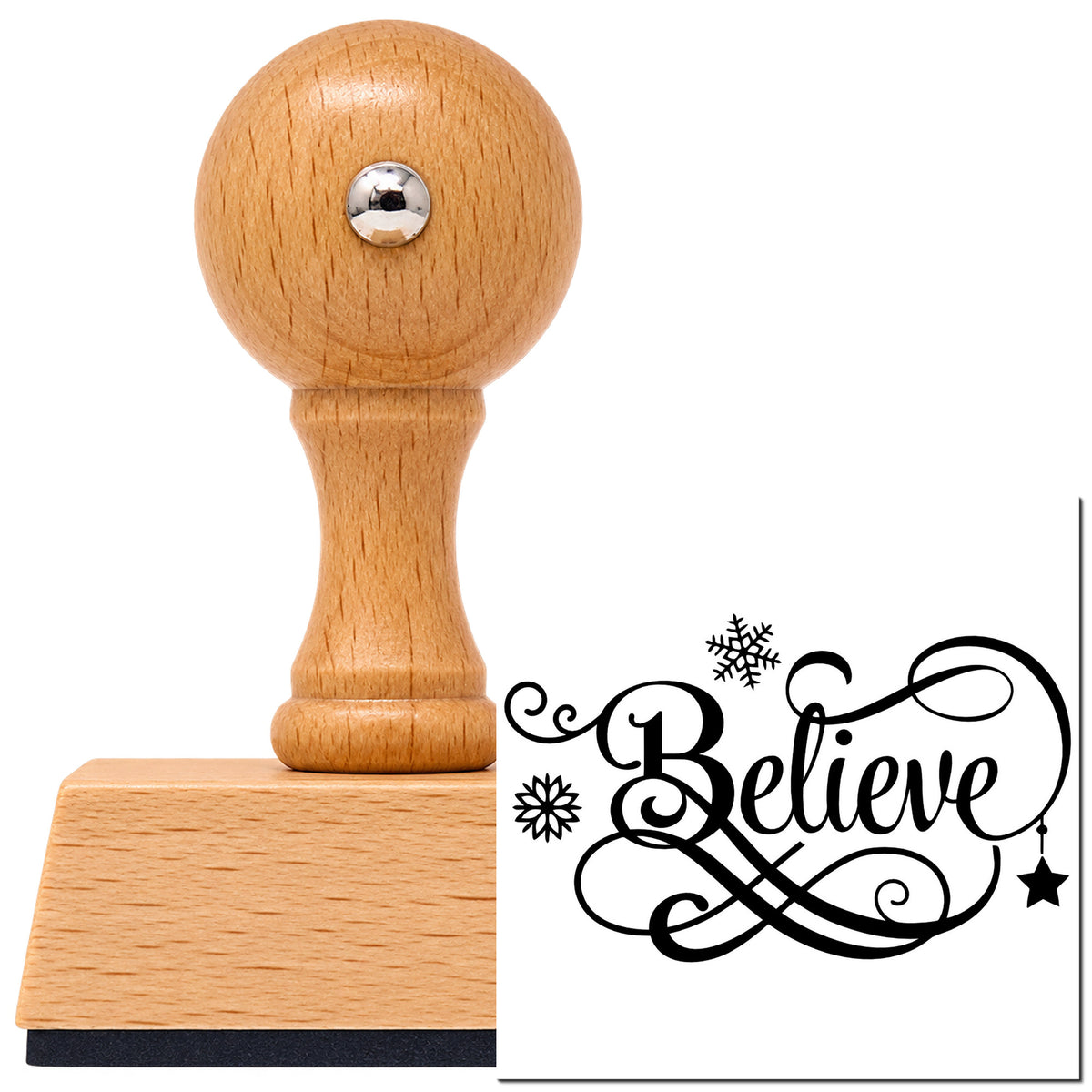 Vintage Pro beech wood stamp with a round knob handle, shown with its black Believe Snowflakes Hanging Star Script Lettering imprint on white.