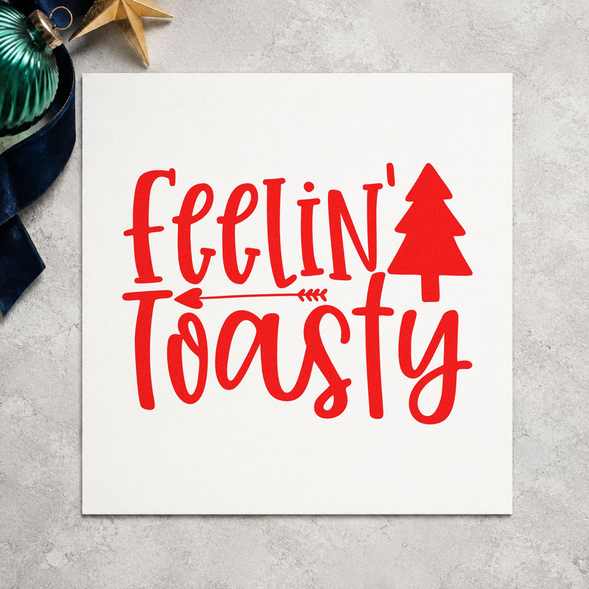 Feelin Toasty Christmas Tree craft stamp in red ink on cardstock, an easy option for throw fringe printing.