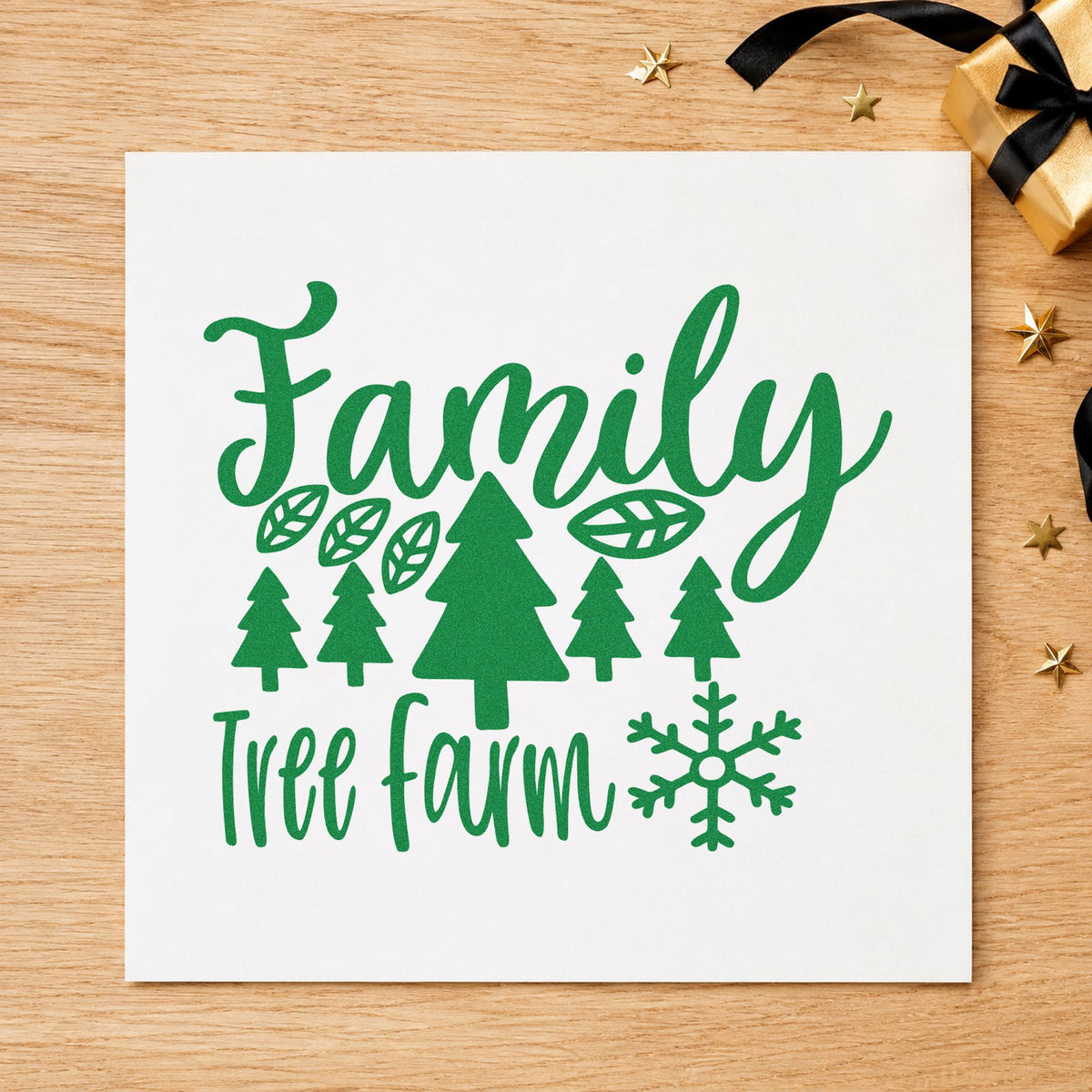 Family Tree Farm Winter craft stamp imprint in green ink on a handmade project, one idea being choose cut tags.