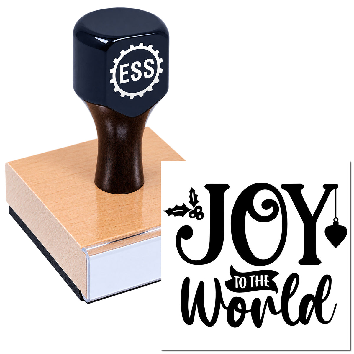 Black custom rubber stamp on a pink wooden seal block with "JOY to the World" holiday design.