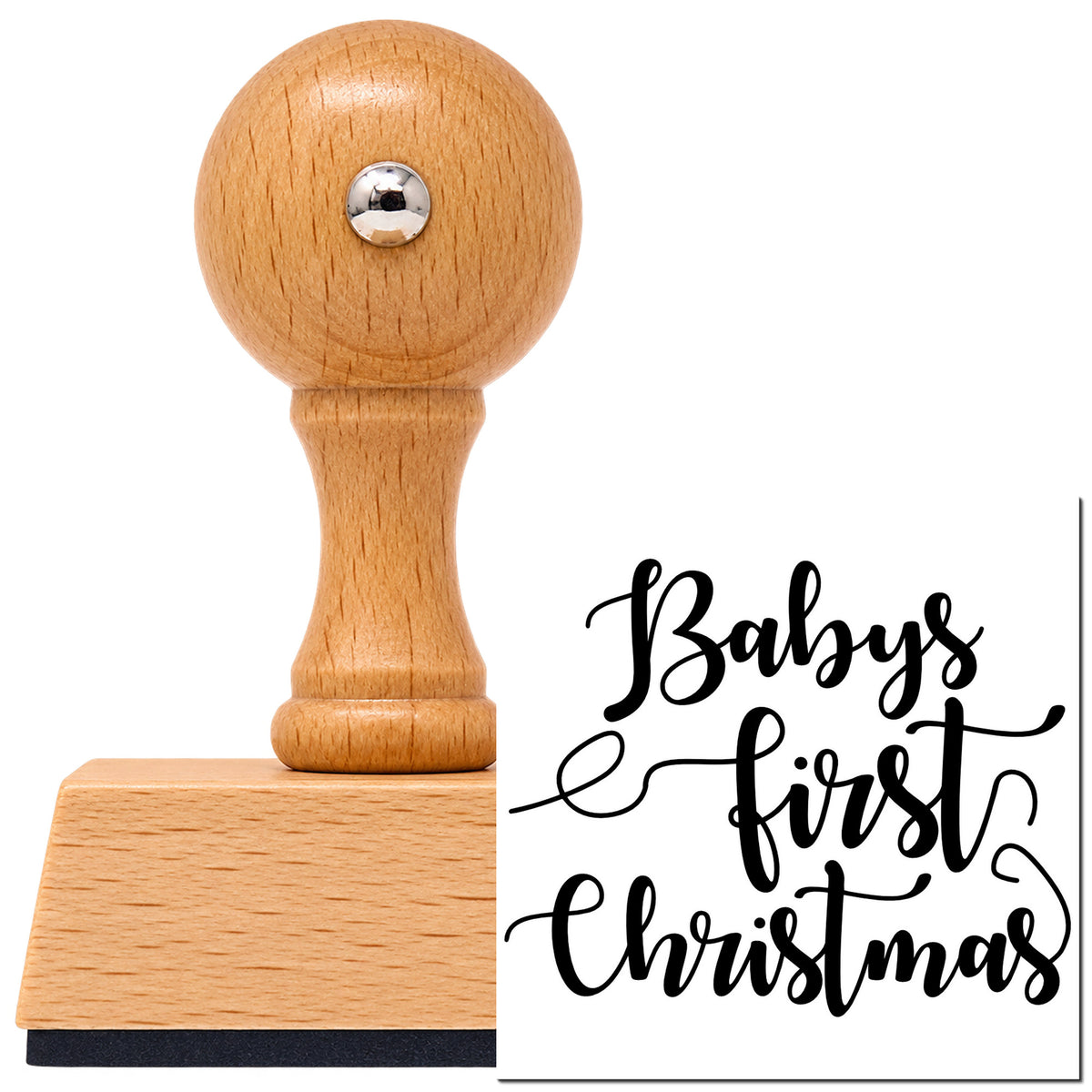 Vintage Pro beech wood stamp with a round knob handle, shown with its black Baby's First Christmas imprint on white.