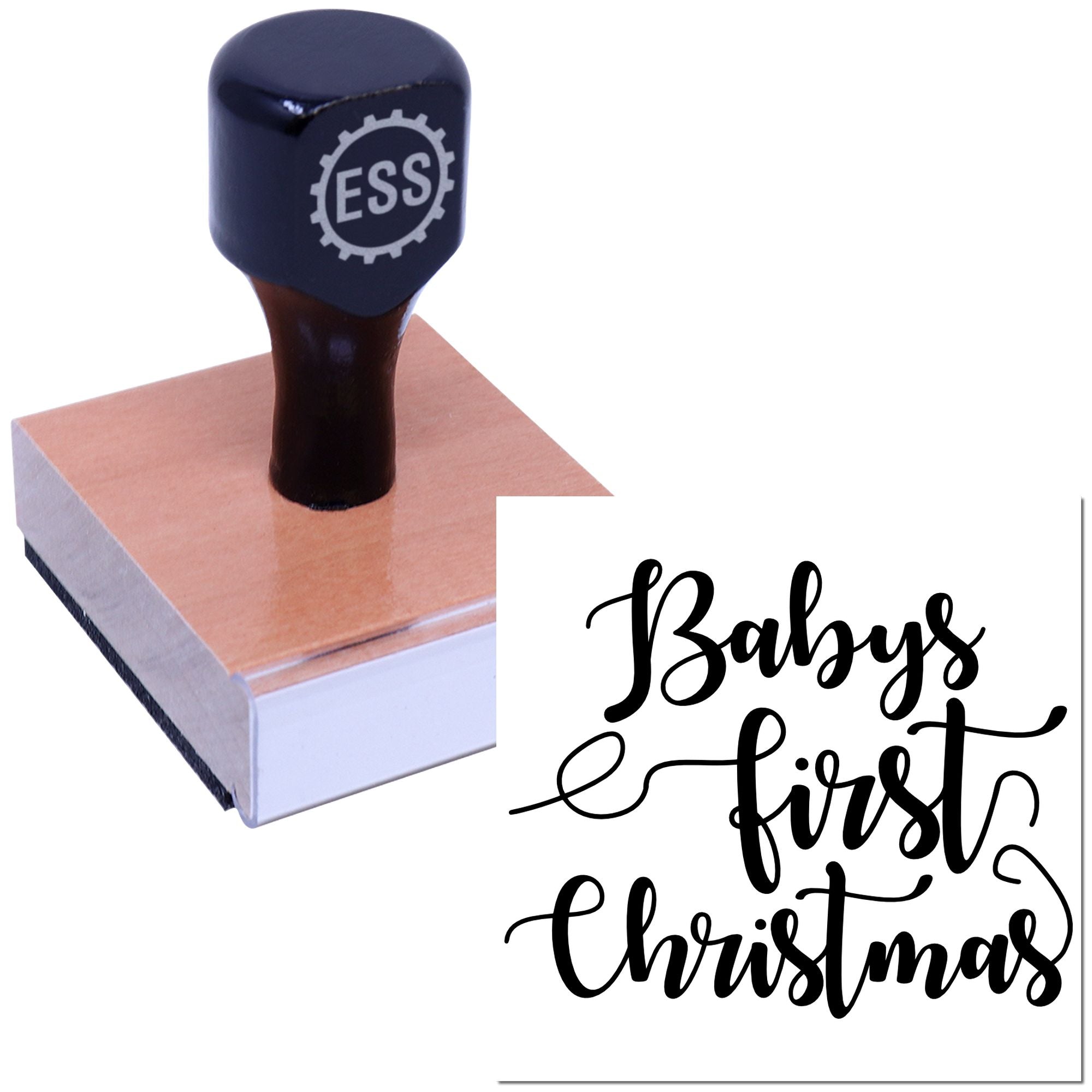 Dark navy ESS stamp and seal on wood block beside black script Babys first Christmas