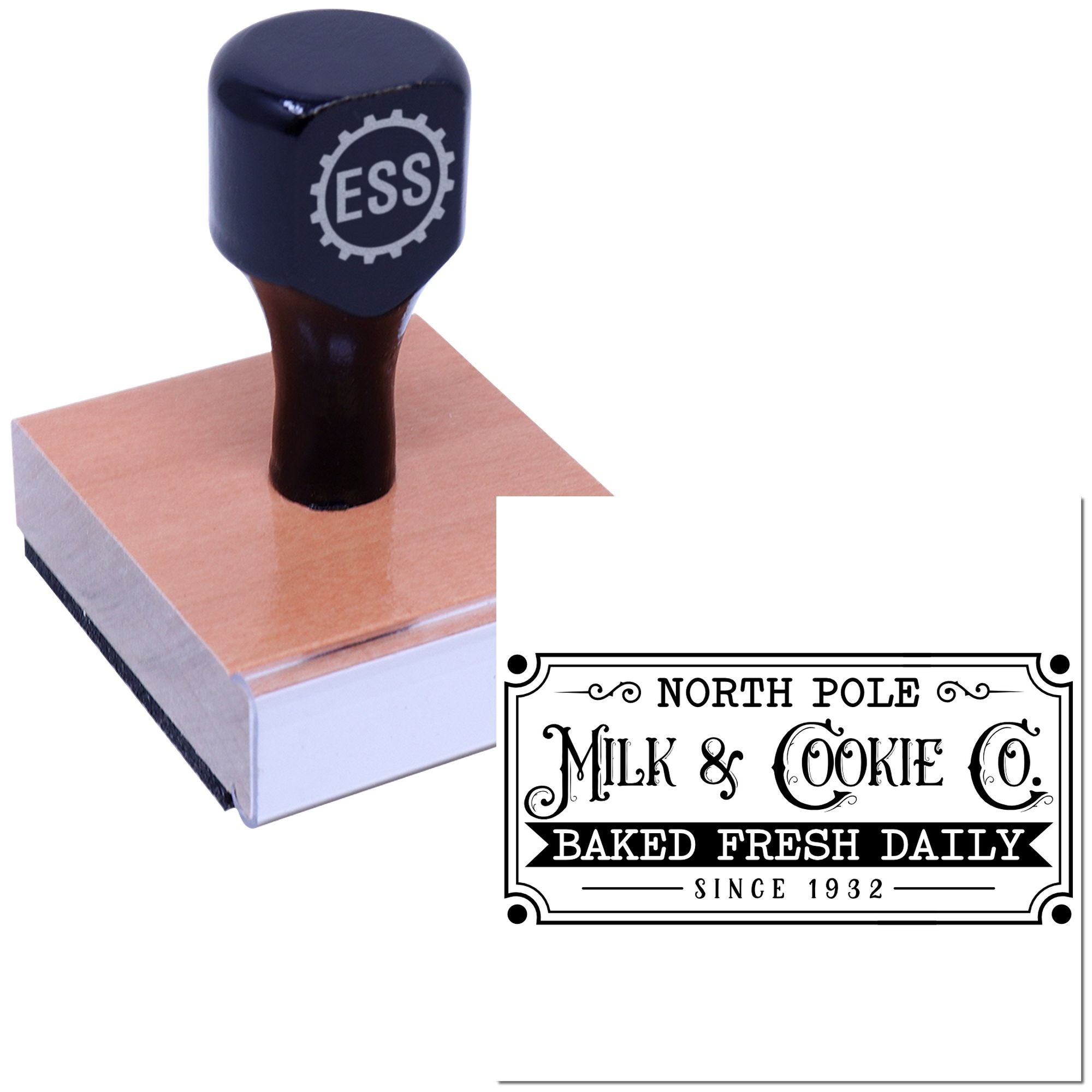 Navy ESS rubber stamp on pink wooden block, with black-and-white bakery seal design reading North Pole Milk & Cookie Co.
