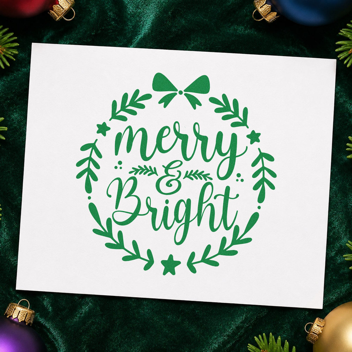 Merry And Bright Wreath craft stamp imprint in green ink on a handmade project, one idea being ring loop gift tags.