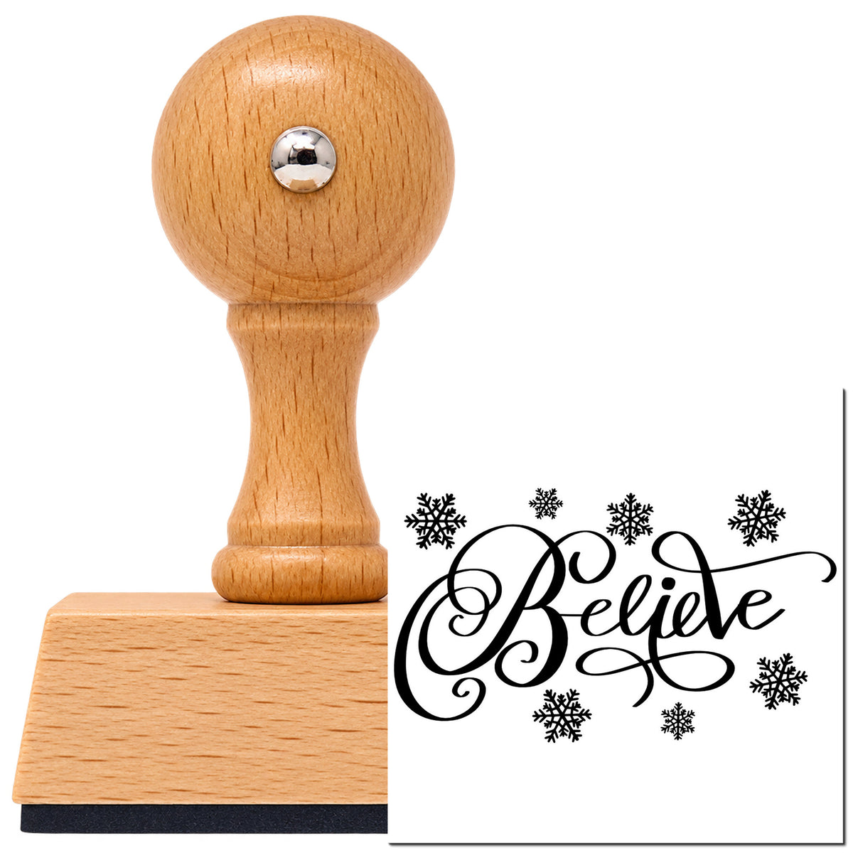 Vintage Pro beech wood stamp with a round knob handle, shown with its black Believe Surrounded By Snowflakes imprint on white.