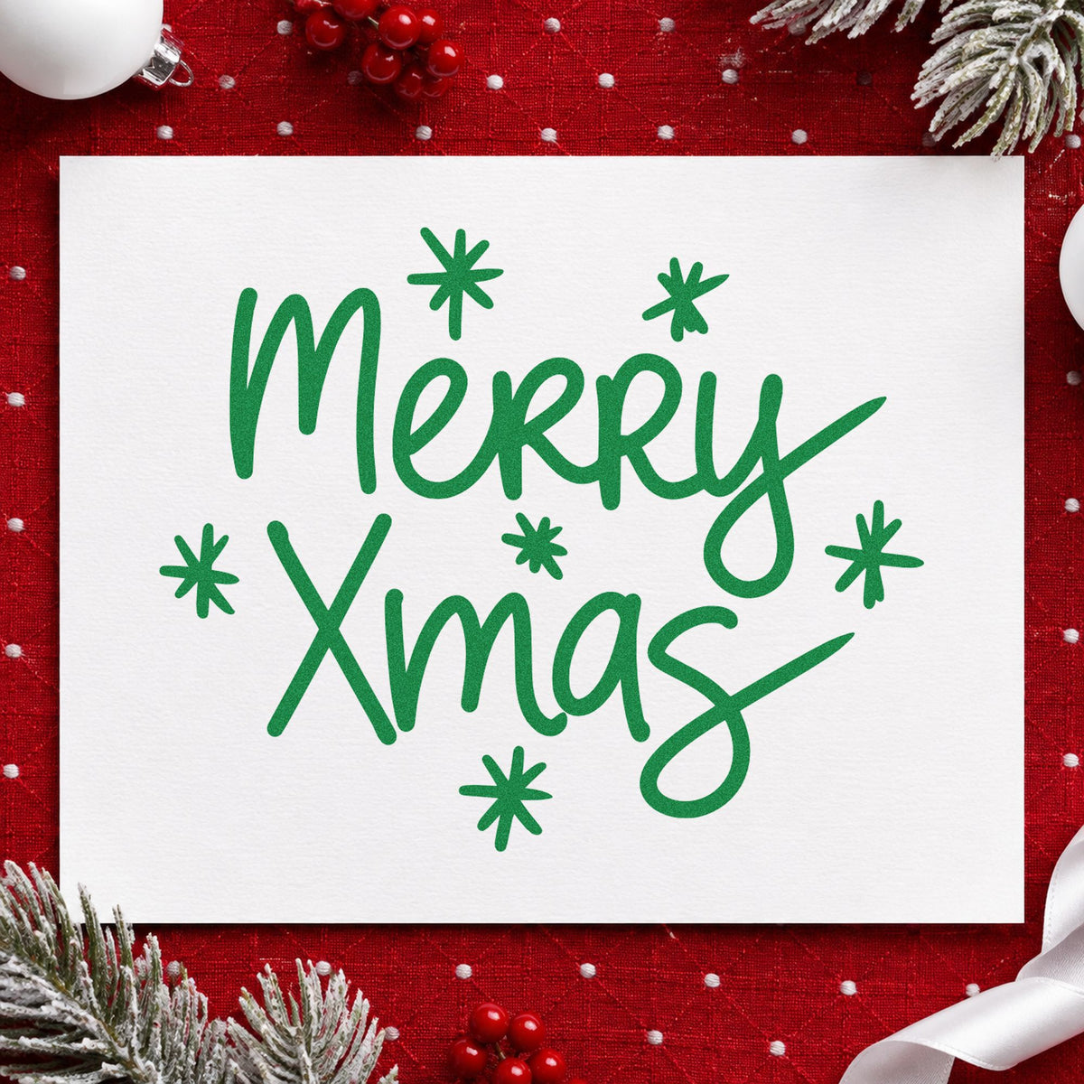 Merry Xmas Starbursts craft stamp imprint in green ink on a handmade project, one idea being fast gift tags.