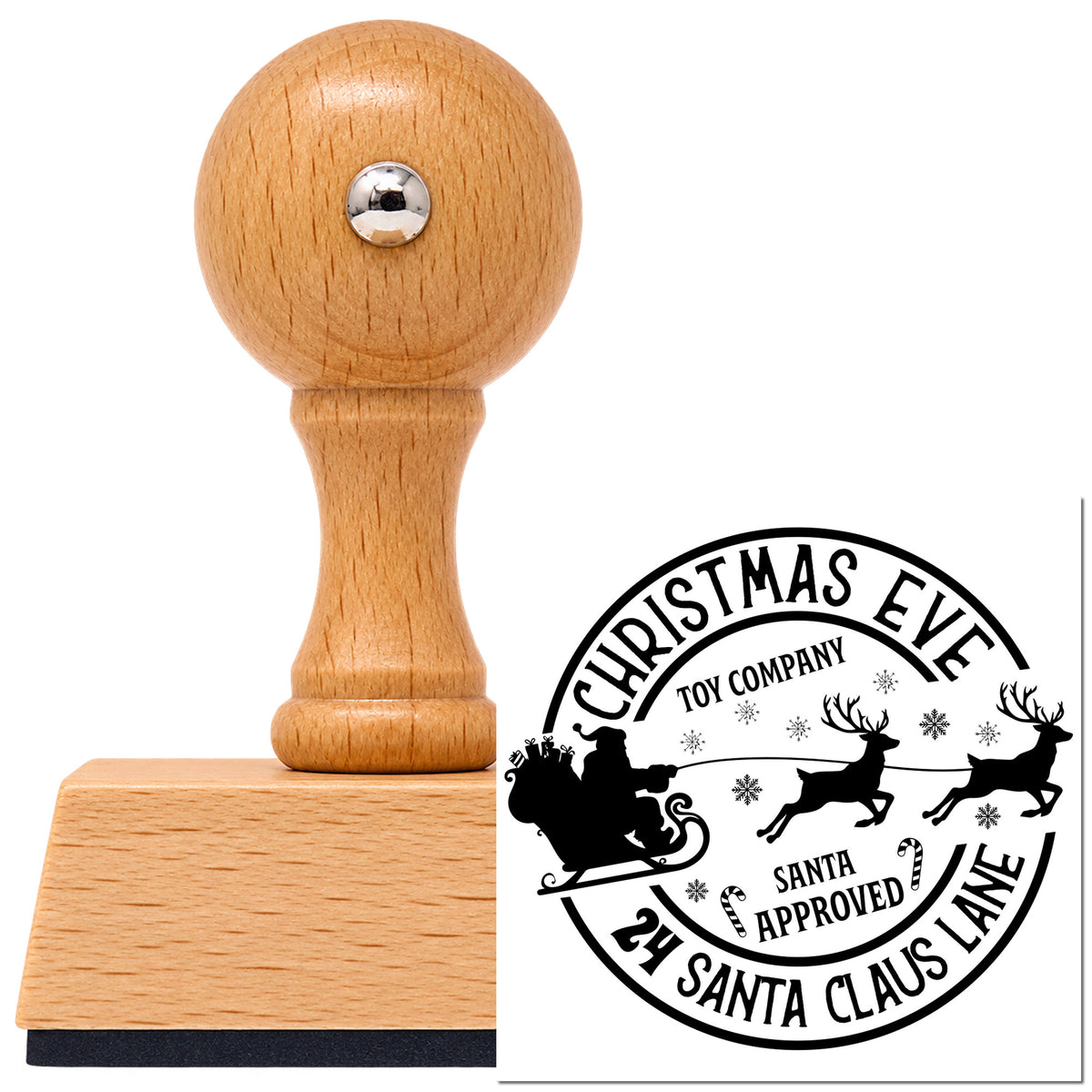 Vintage Pro beech wood stamp with a round knob handle, shown with its black Christmas Eve Toy Company Reindeer imprint on white.