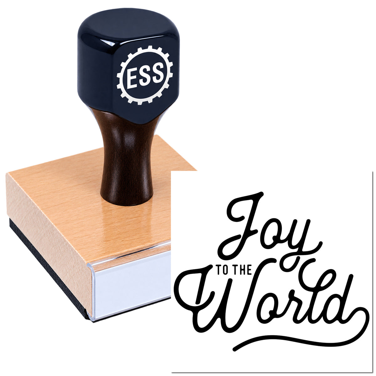 Black ESSI stamp with wooden handle on a copper-toned block, showing a "Joy to the World" seal in script.