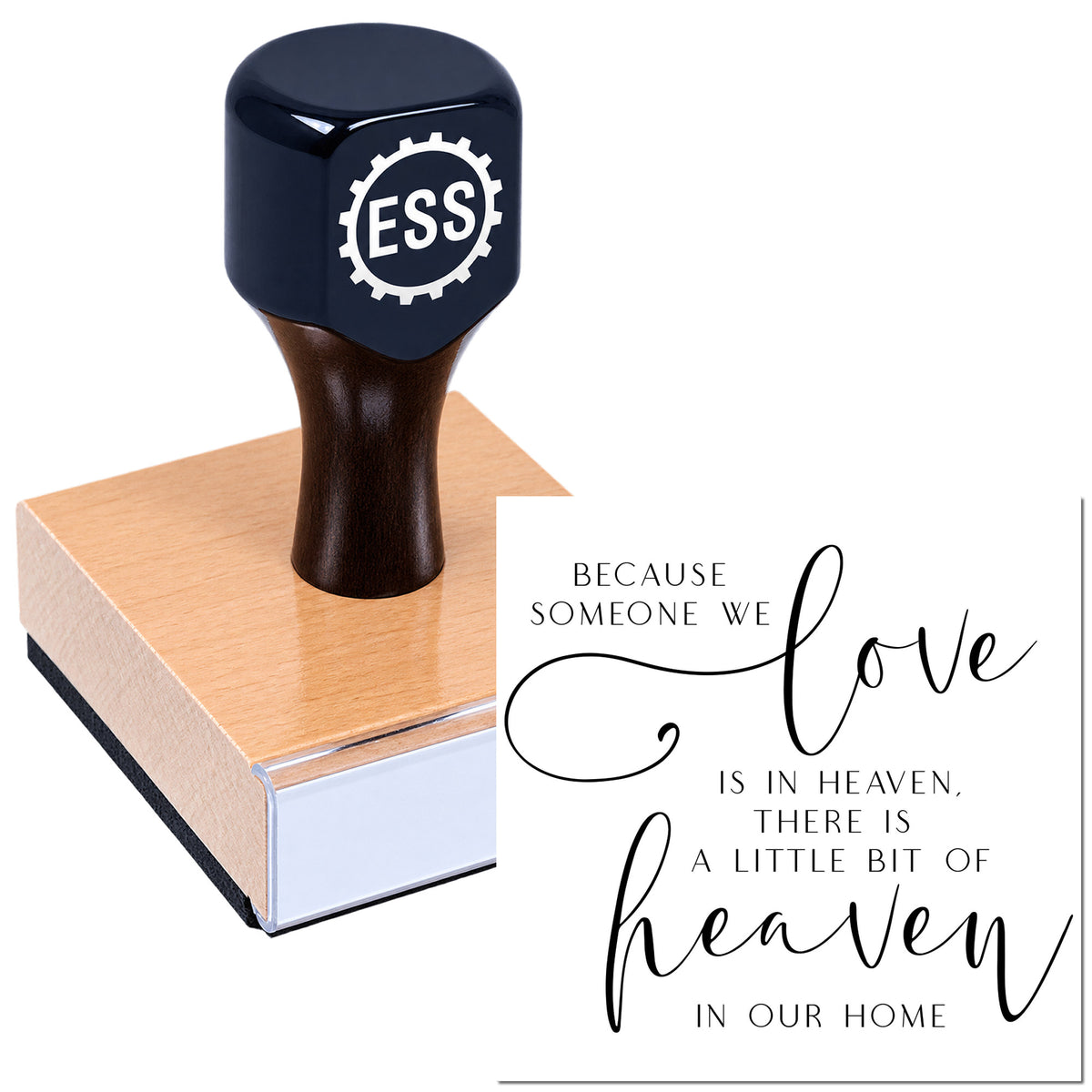 Black ESS seal stamp on a wooden block beside a white memorial quote card with black script reading "love" and "heaven."