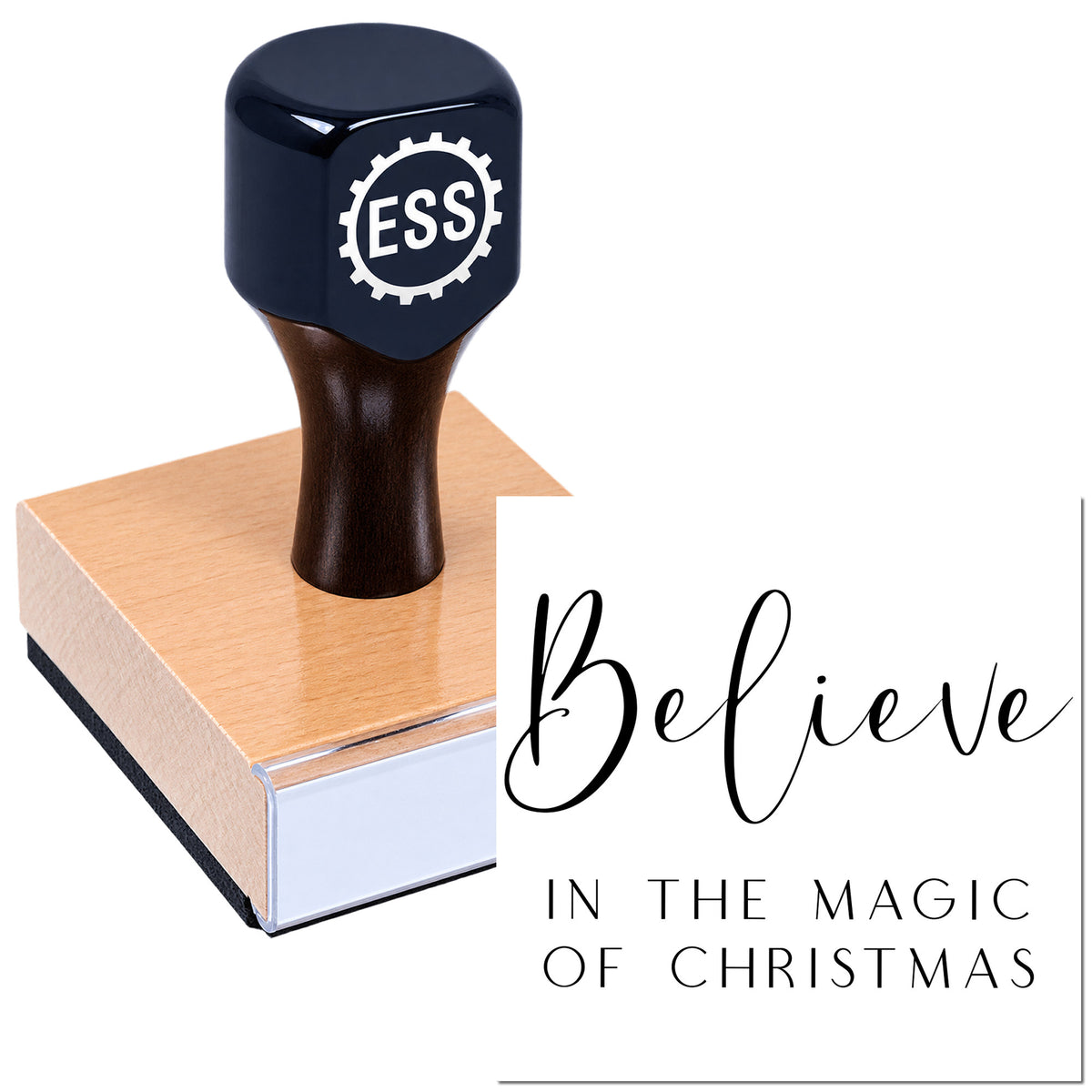 Black ESS rubber seal stamp on a copper block, with white gear logo and "Believe" Christmas text