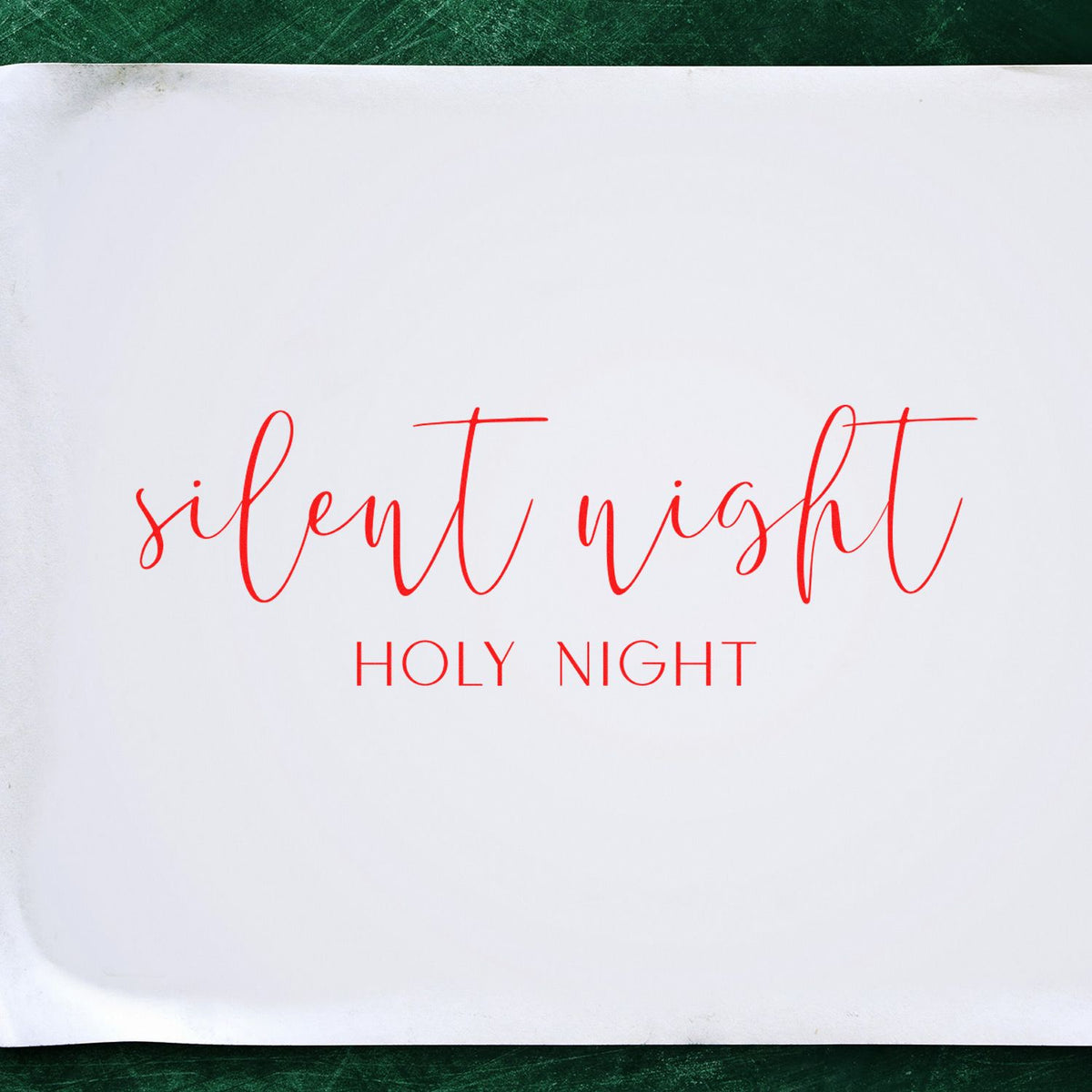 Red Silent Night Holy Night stamp and seal on white paper, featuring elegant script and serif holiday lettering.