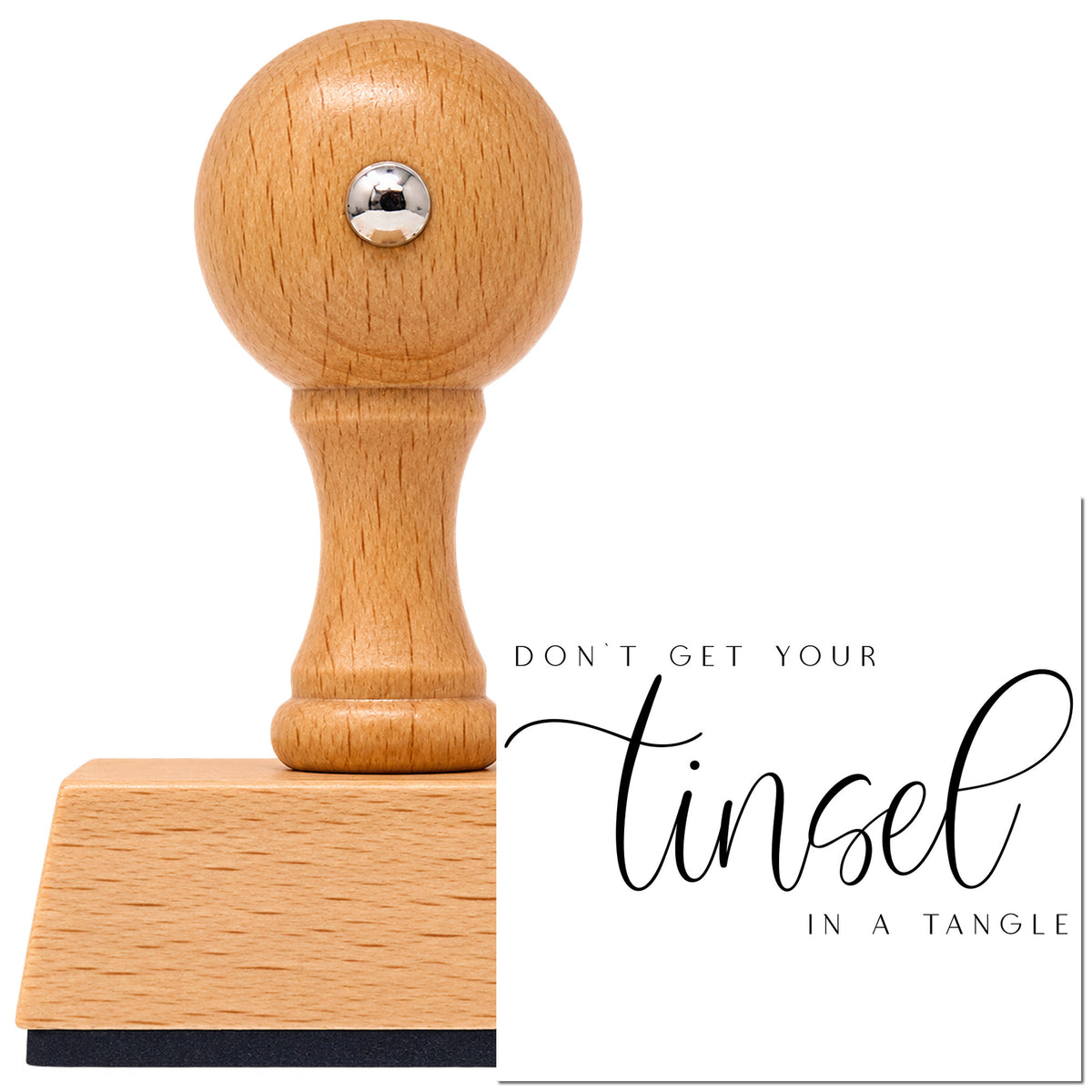 Vintage Pro beech wood stamp with a round knob handle, shown with its black Don't Get Tinsel Tangled imprint on white.