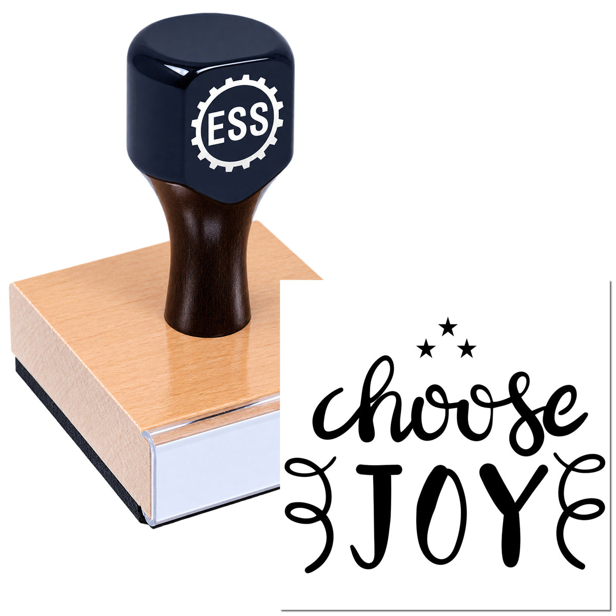 Dark navy ESS seal stamp on wooden block with black "choose JOY" lettering and stars on white background.
