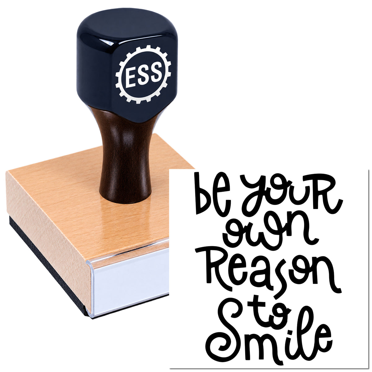 Black ESS stamp and seal on a pink block with bold black "be your own reason to smile" text.