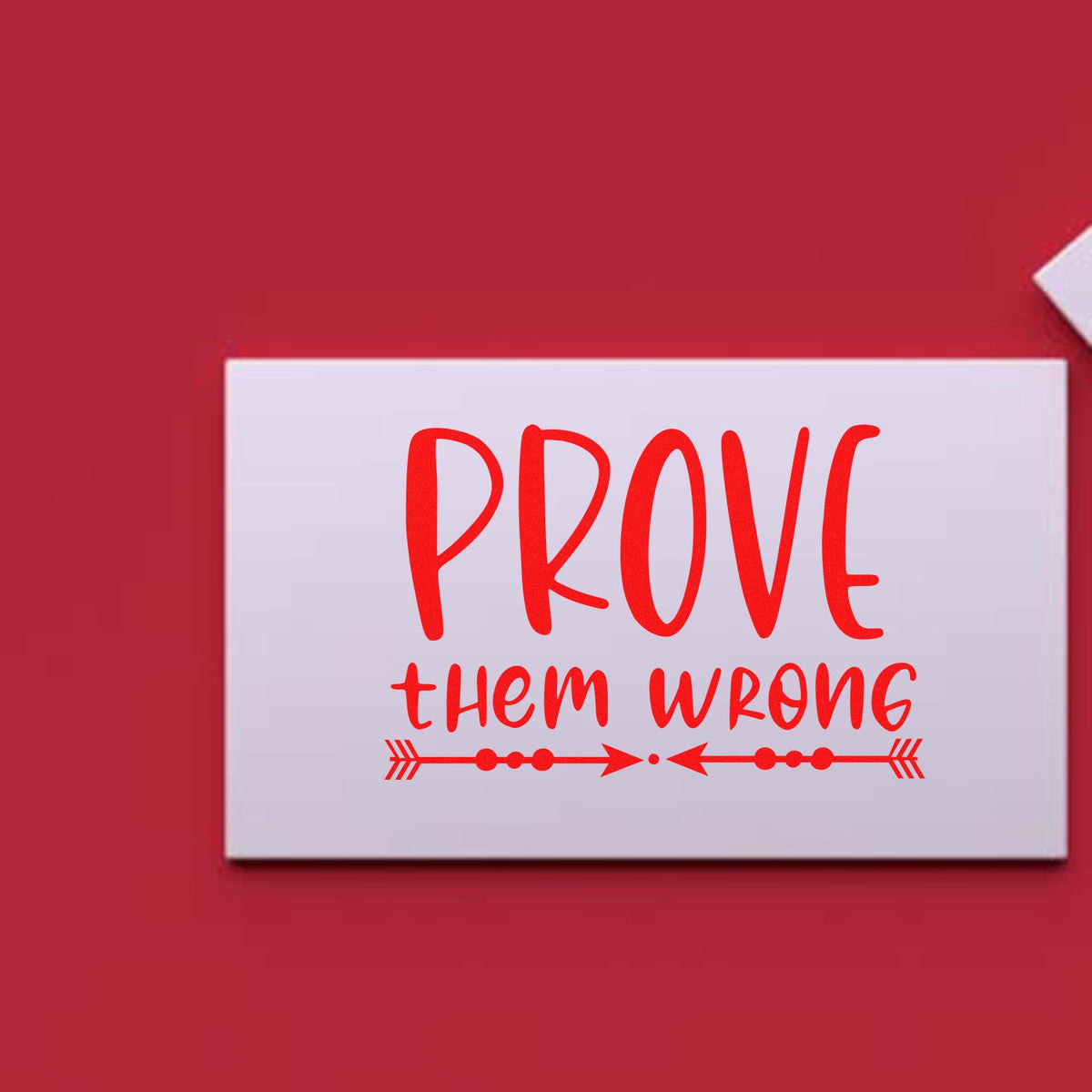 Red stamp-style seal on white card reading PROVE them WRONG with decorative arrows on a red background.