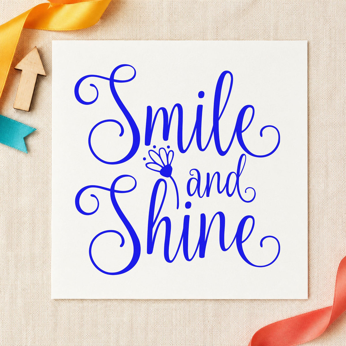 Smile And Shine Flower craft stamp in blue ink on cardstock, an easy option for cape trim printing.