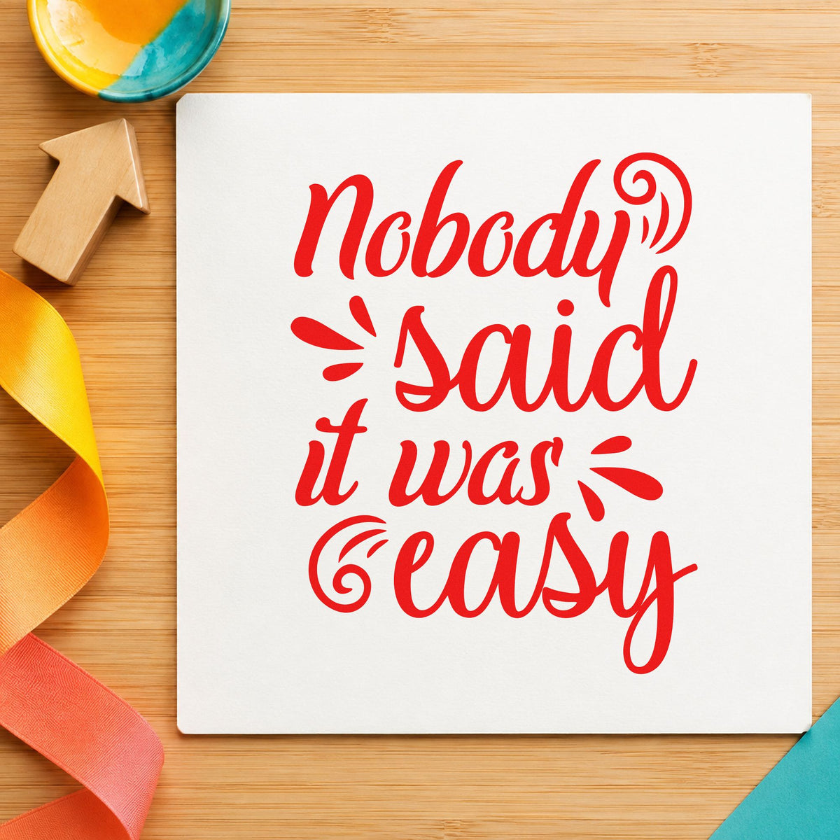 Nobody Said It Was Easy craft stamp imprint in red ink on a handmade project, one idea being project note cards.