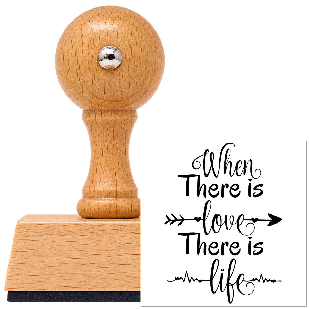Vintage Pro beech wood stamp with a round knob handle, shown with its black Love And Life Heartbeat Arrow imprint on white.