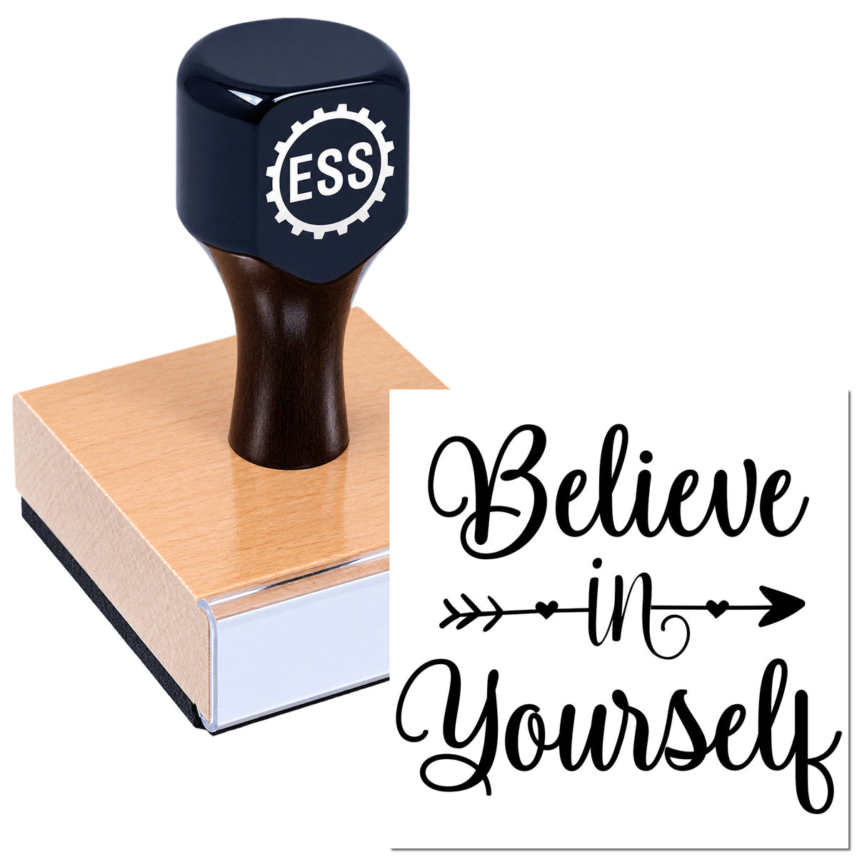 Dark navy ESSI rubber stamp on a wood block with a white "Believe in Yourself" design.