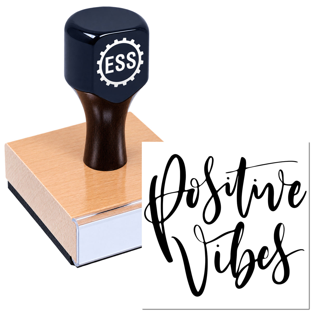 Dark navy ESS rubber stamp with wooden base, showing a bold black Positive Vibes seal impression.