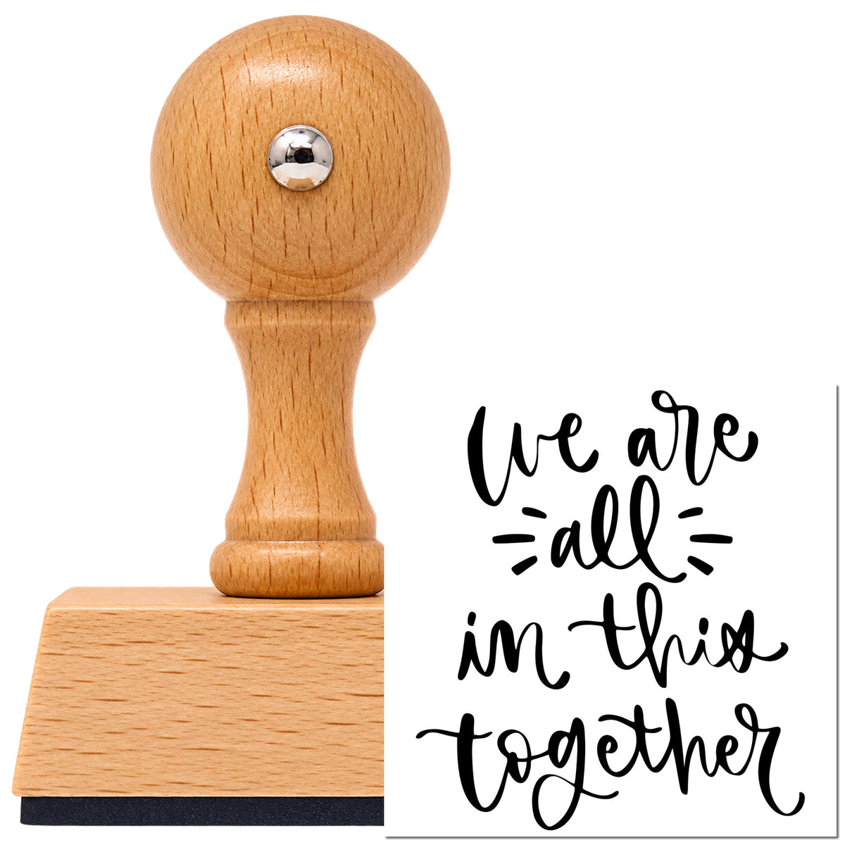 Vintage Pro beech wood stamp with a round knob handle, shown with its black We Are All In Together imprint on white.