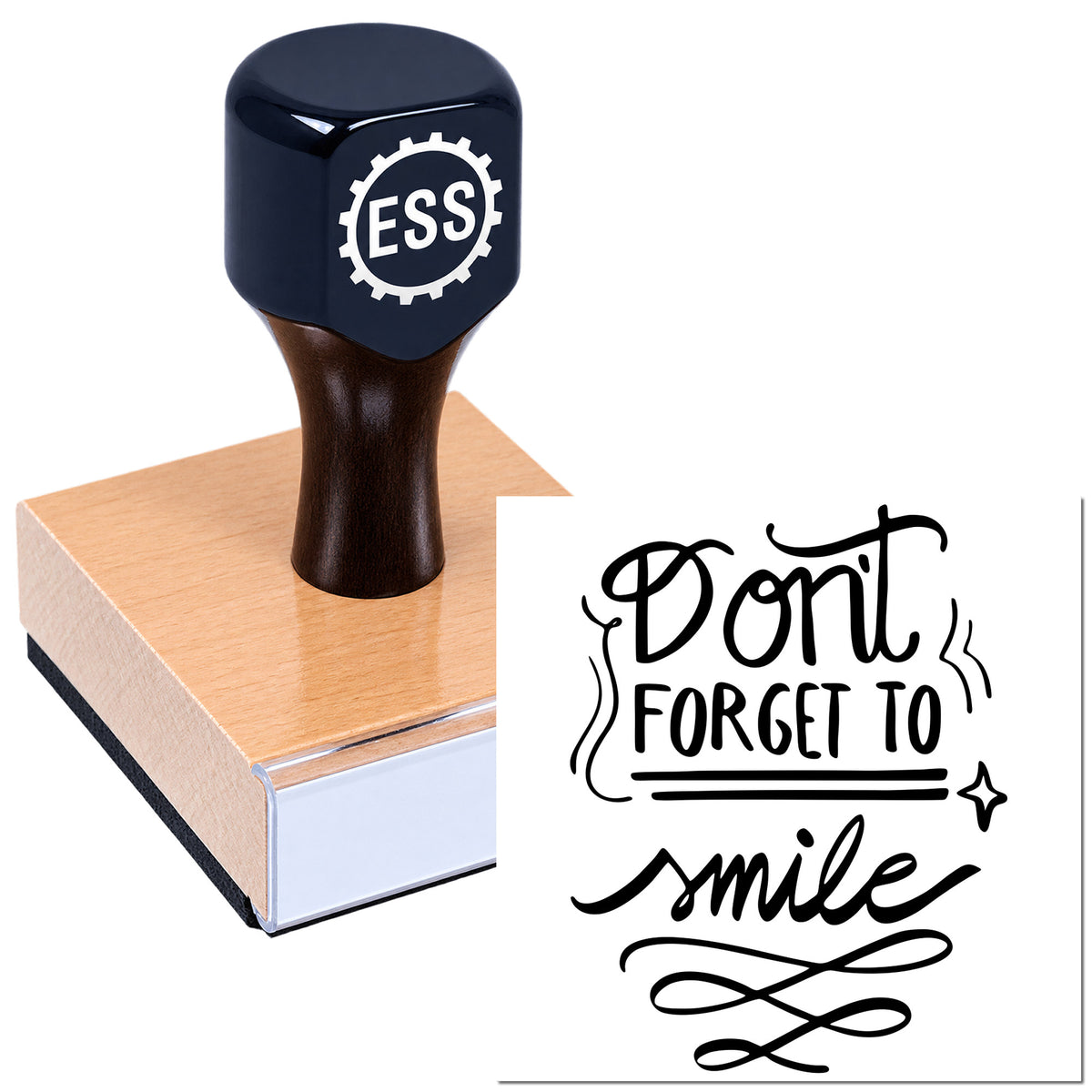Black self-inking stamp with ESS logo on a pink block beside a decorative black "Don't forget to smile" seal.
