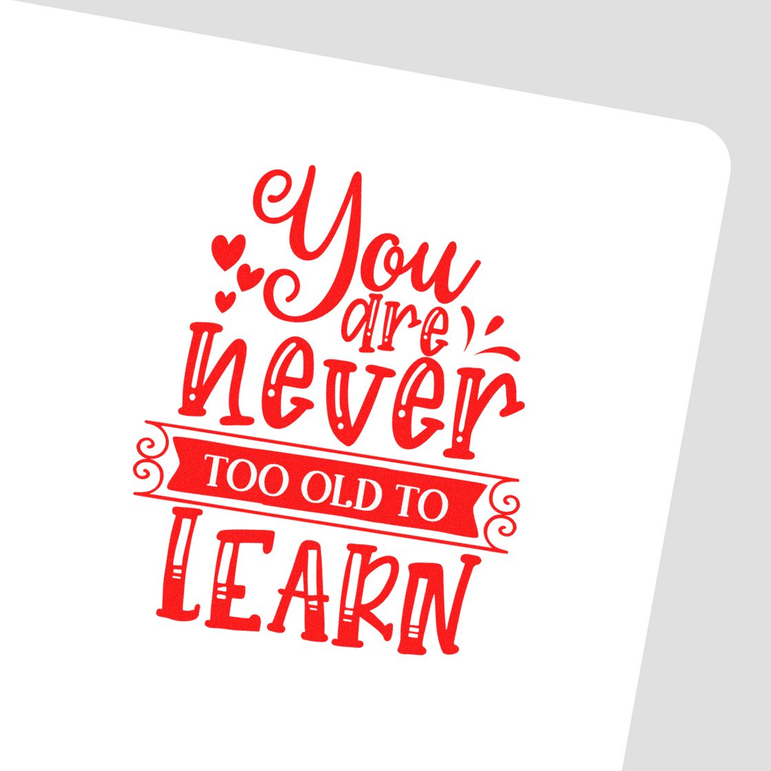 Red rubber stamp and seal design with "You are never too old to learn" text, hearts, and banner on white.