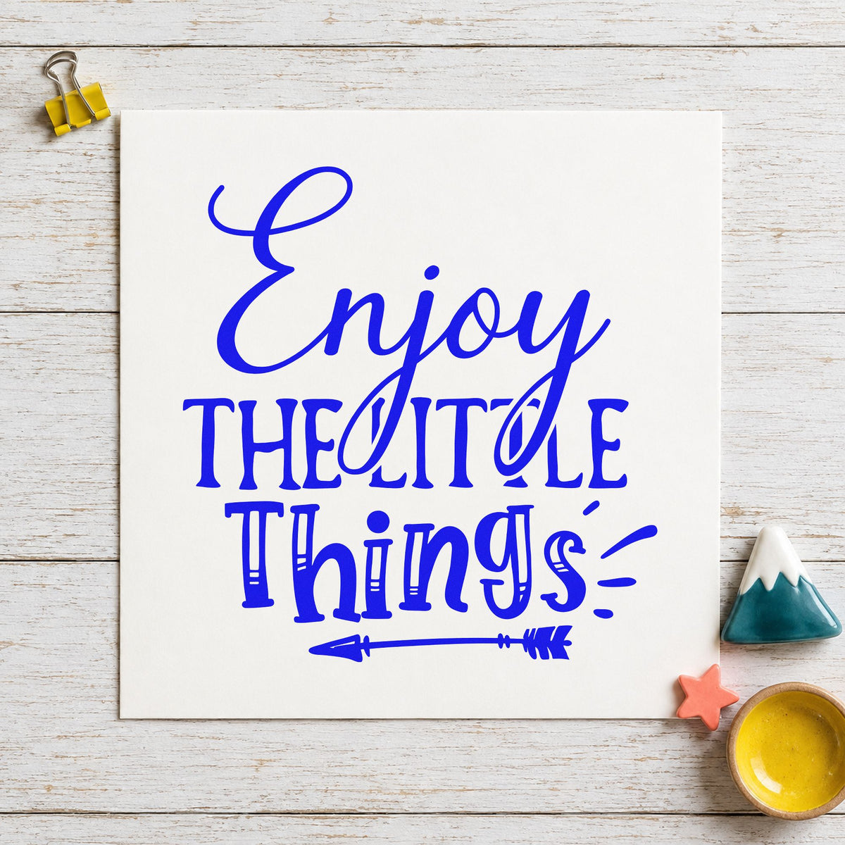 Enjoy The Little Things Arrow craft stamp in blue ink on cardstock, an easy option for dust cover printing.