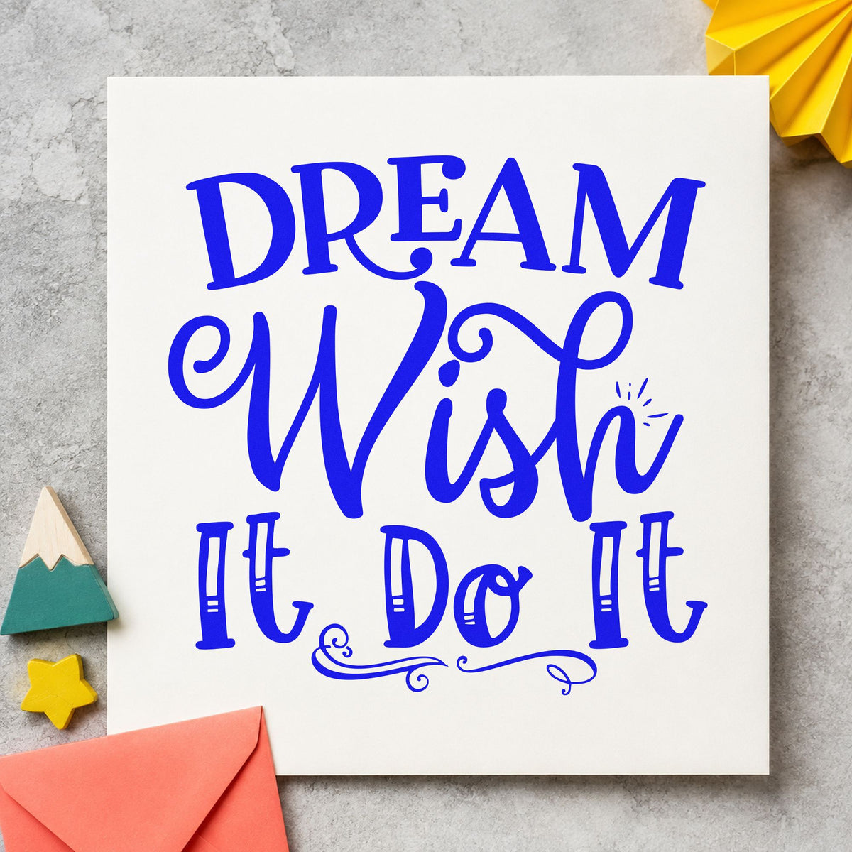 Dream Wish Do It craft stamp imprinted in blue ink on paper, a design suited to framed bedroom door.
