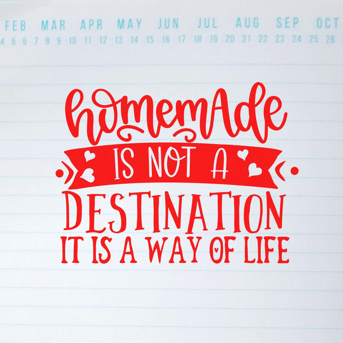 Red decorative stamp seal on lined paper reads HomeMade is not a destination, it is a way of life with white hearts.