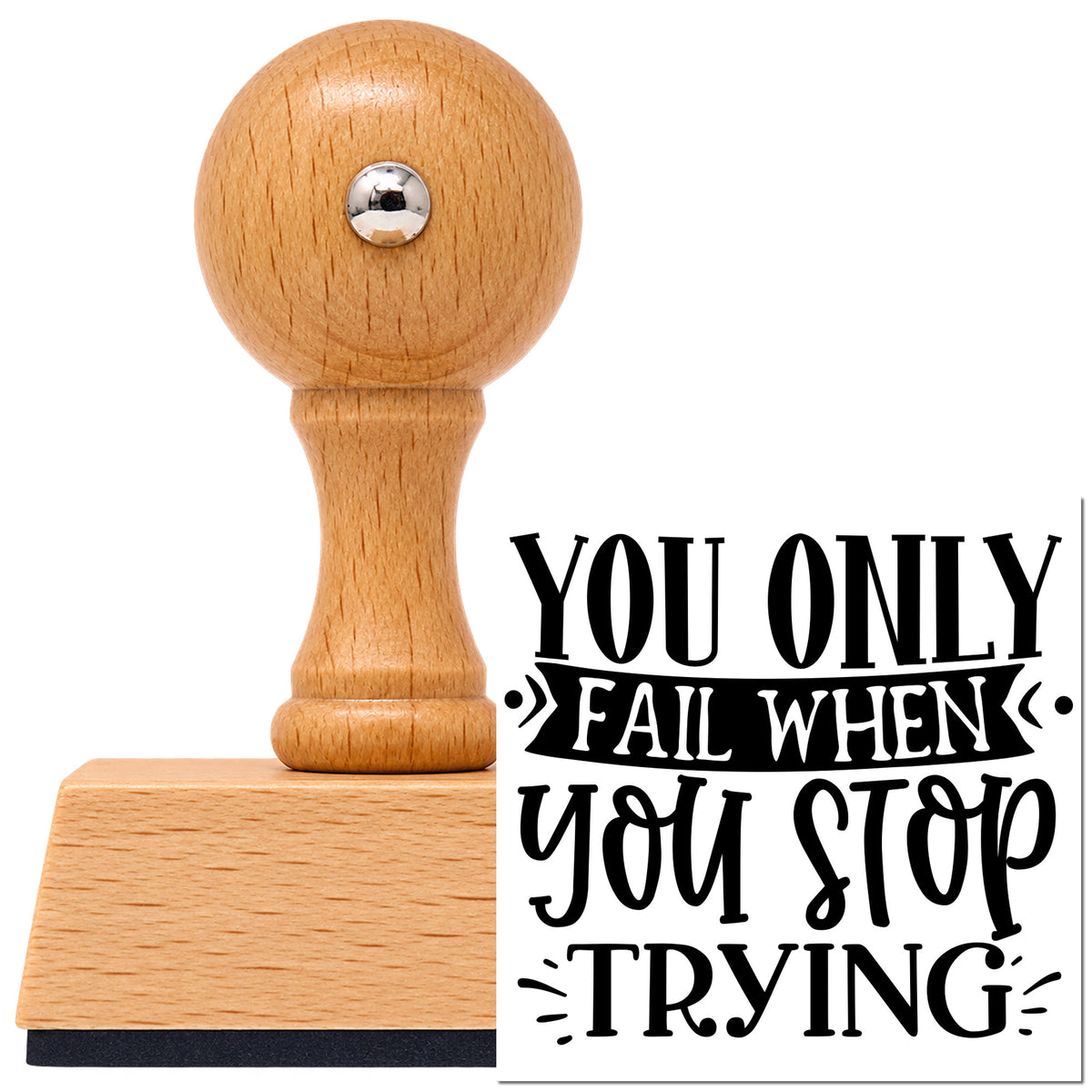 Vintage Pro beech wood stamp with a round knob handle, shown with its black You Only Fail When You Stop Trying imprint on white.