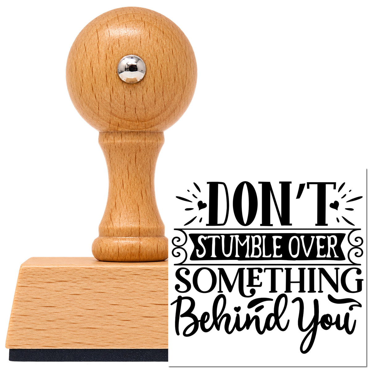 Vintage Pro beech wood stamp with a round knob handle, shown with its black Don't Stumble Over Behind You imprint on white.