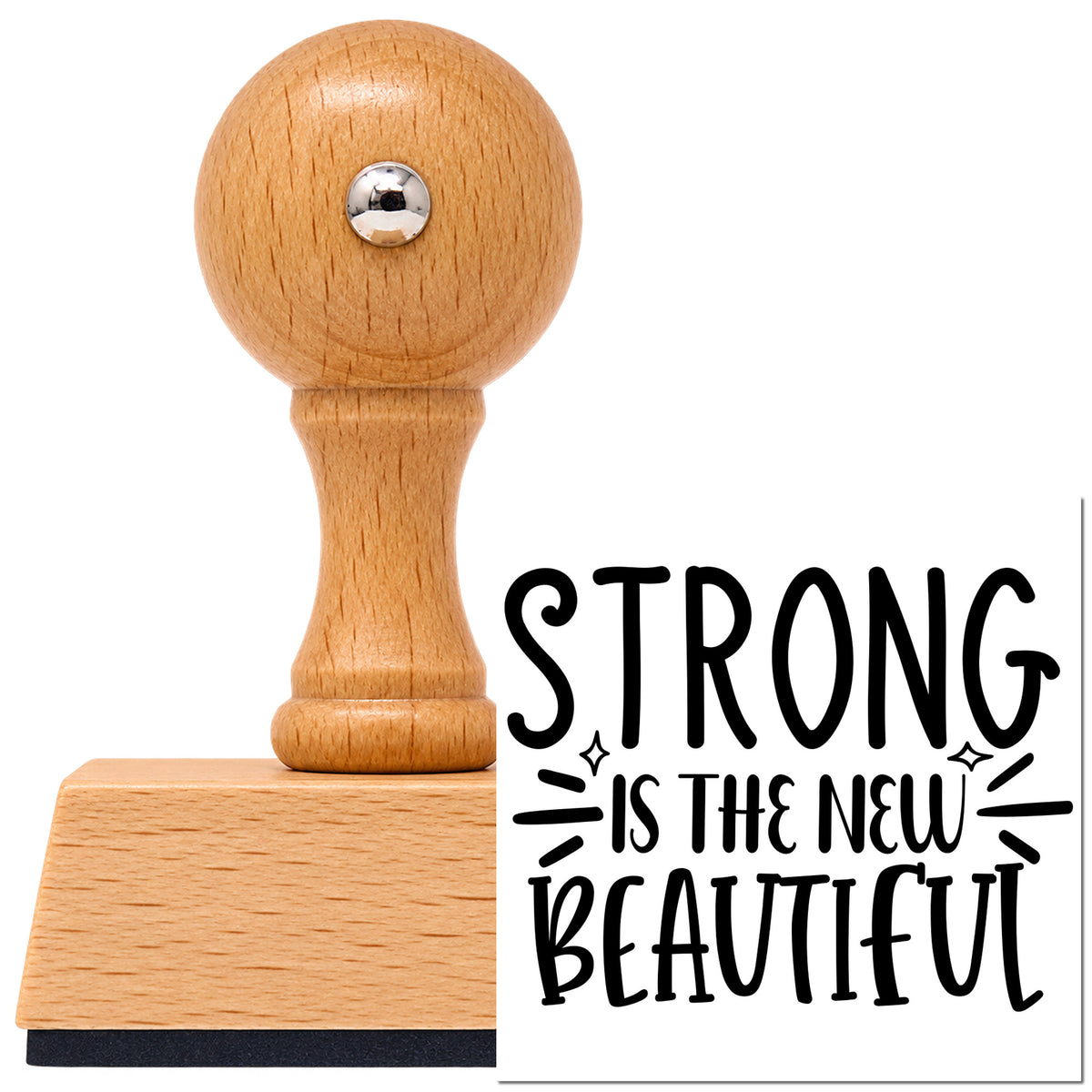 Vintage Pro beech wood stamp with a round knob handle, shown with its black Strong Is The New Beautiful imprint on white.