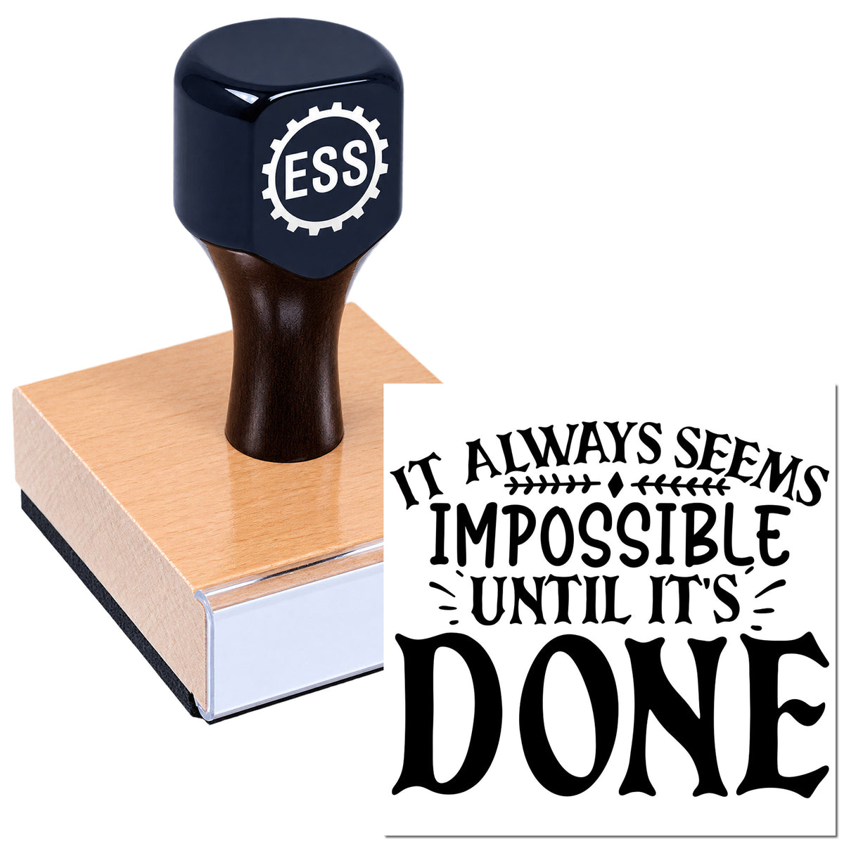 Black ESS stamp and seal on wooden base with quote impression, "It always seems impossible until it's done."