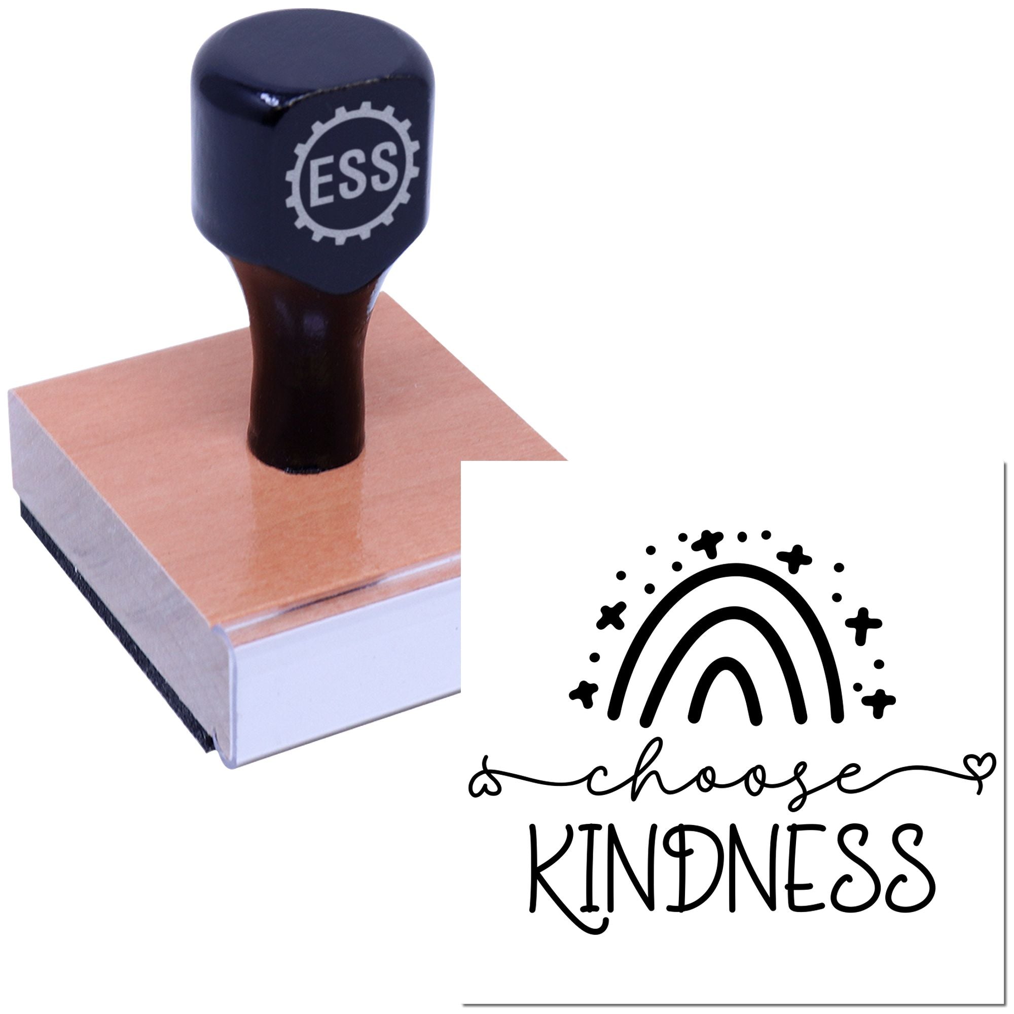 Dark navy ESS custom stamp with wooden handle on a block, beside a black choose kindness rainbow seal design.
