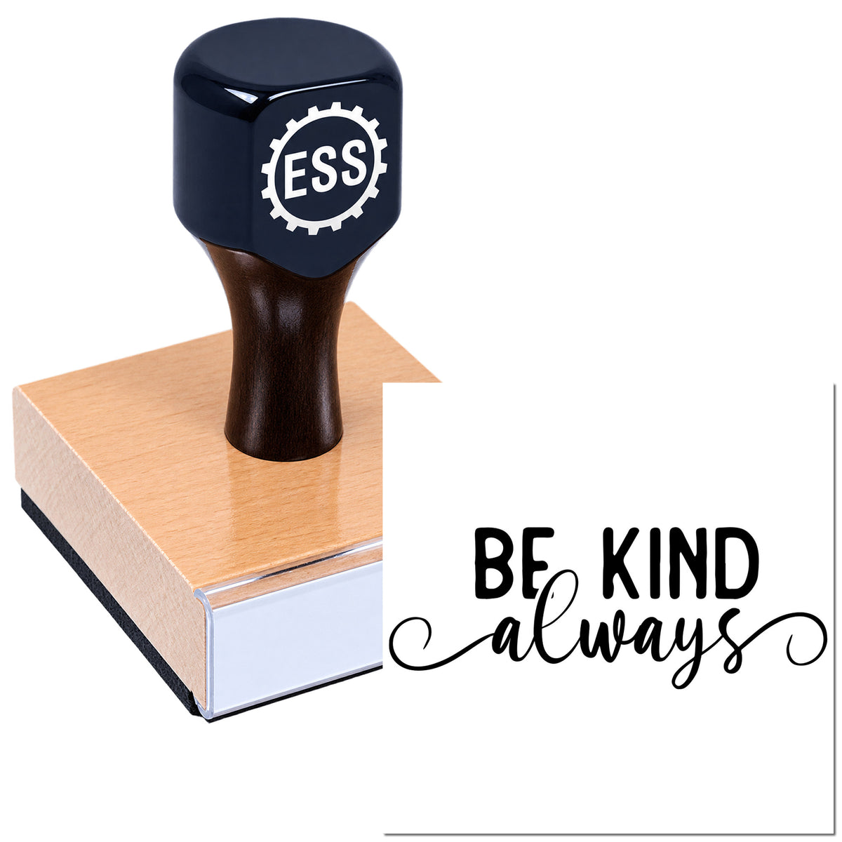 Dark navy ESS rubber stamp on a pink seal block, with "Be Kind Always" script on a white background.