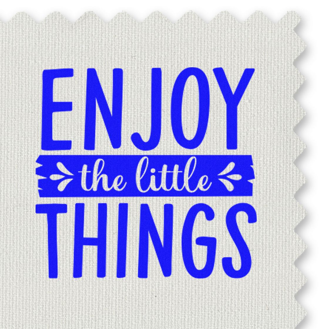 Blue stamp and seal reading Enjoy the little things on white textured fabric with scalloped edges.