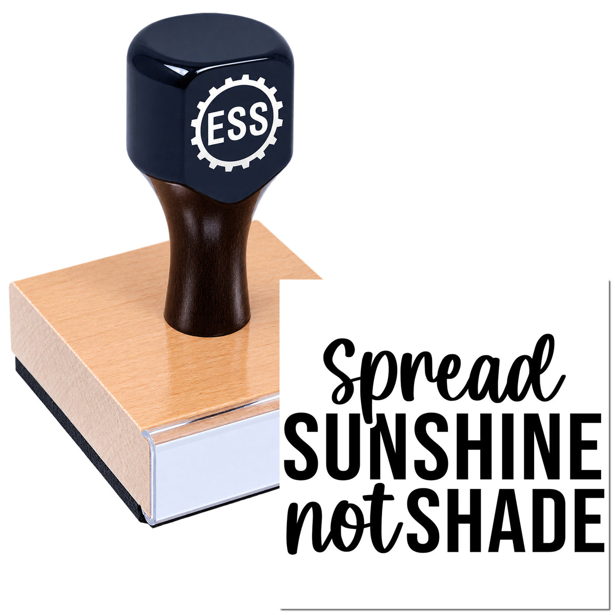 Dark blue ESS rubber stamp and seal on a wooden block with "Spread Sunshine Not Shade" slogan.