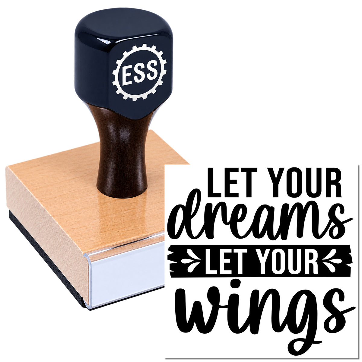 Dark navy custom stamp and seal on peach wood block with ESS gear logo and black "Let Your Dreams Let Your Wings" text
