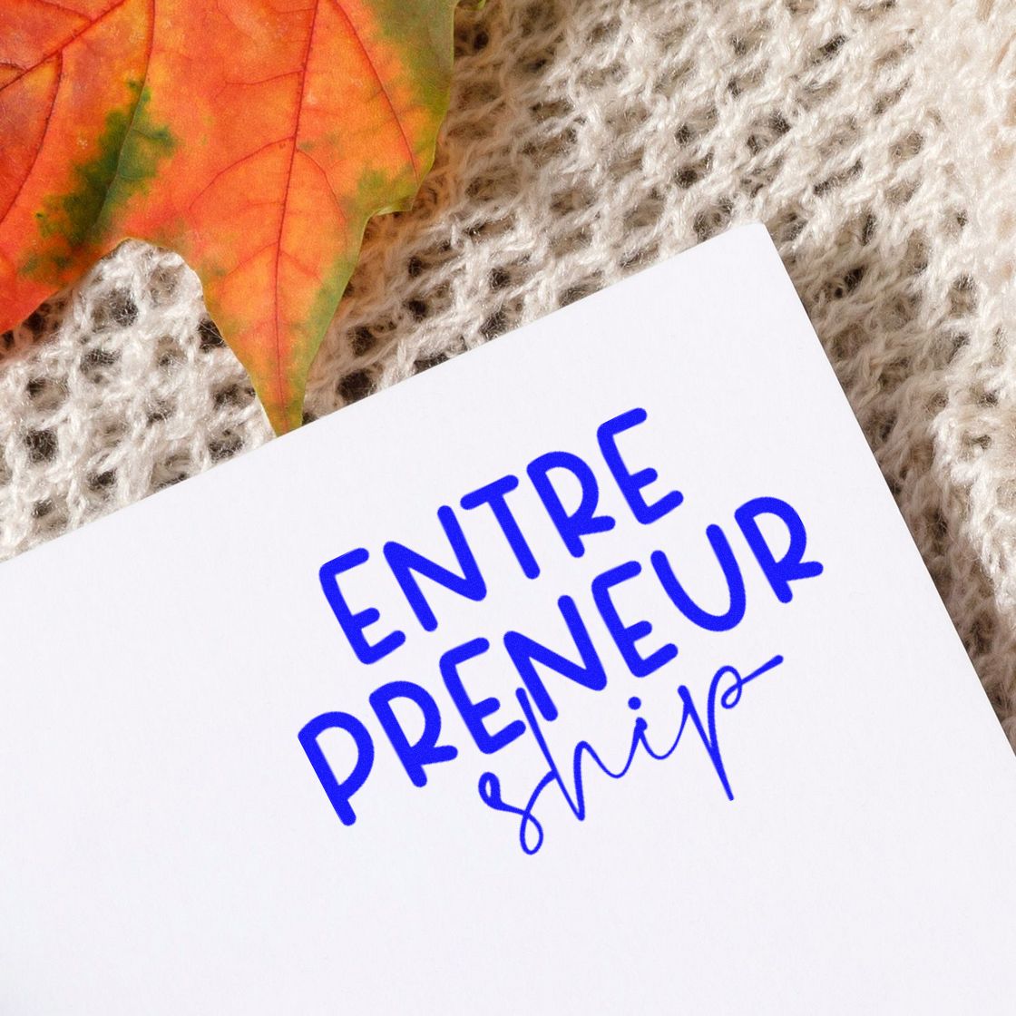 Entrepreneurship Split Lettering rubber stamp shown in blue ink, stamped for projects such as fulfillment album page.