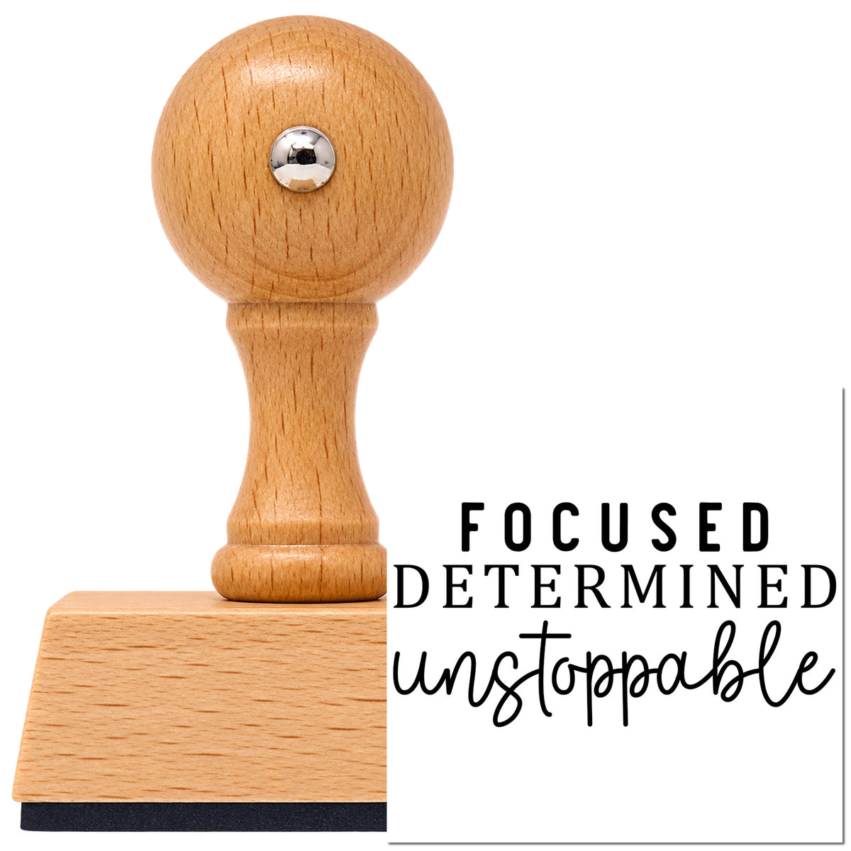 Vintage Pro beech wood stamp with a round knob handle, shown with its black Focused Determined Unstoppable imprint on white.