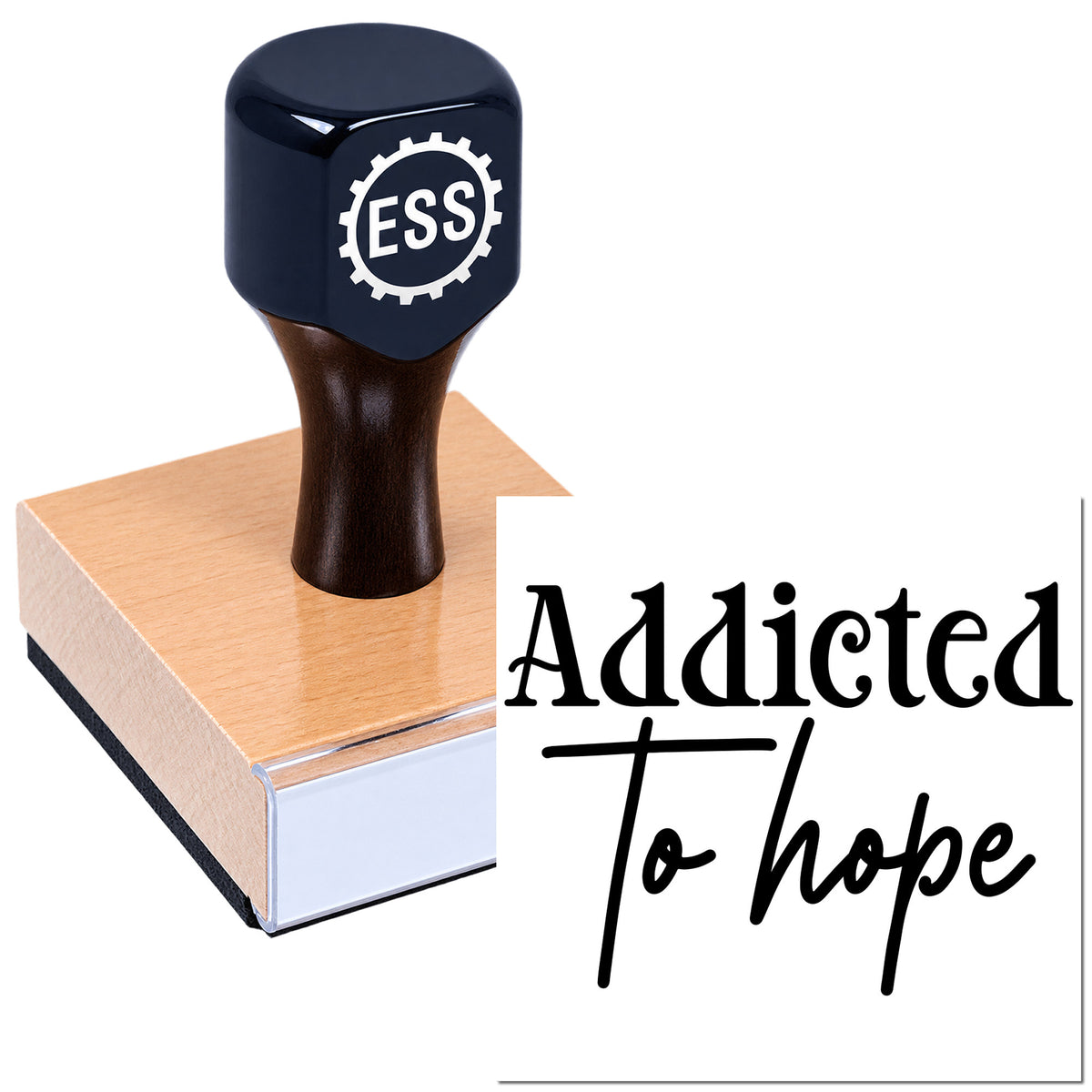 Black ESS hand stamp and copper seal block with "Addicted To Hope" text on a white background