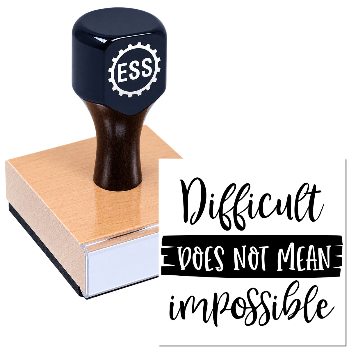 Black ESSI rubber stamp on a wooden block, with white seal text reading "Difficult does not mean impossible"