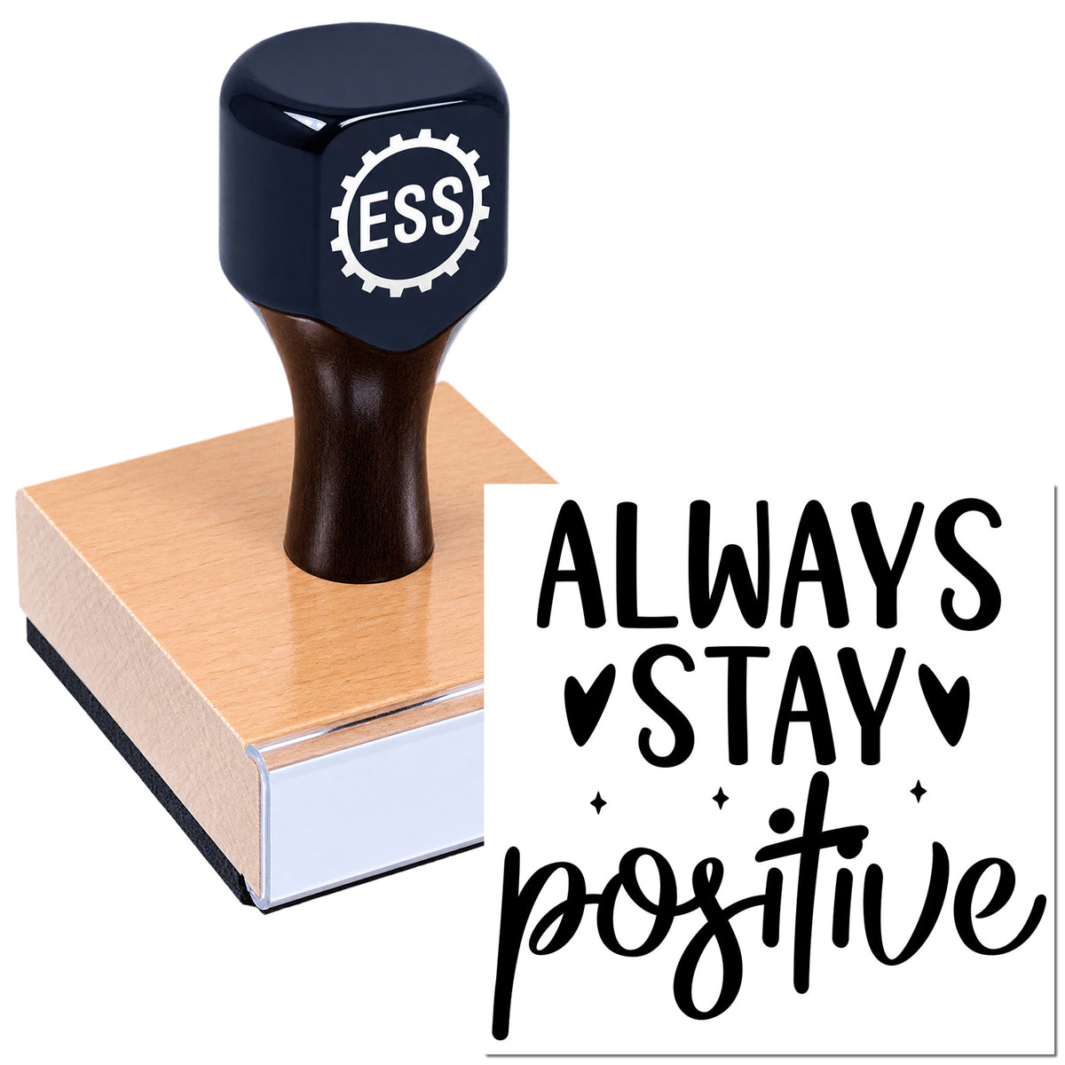 Navy ESSI stamp and seal on a wooden block with black "Always stay positive" lettering.
