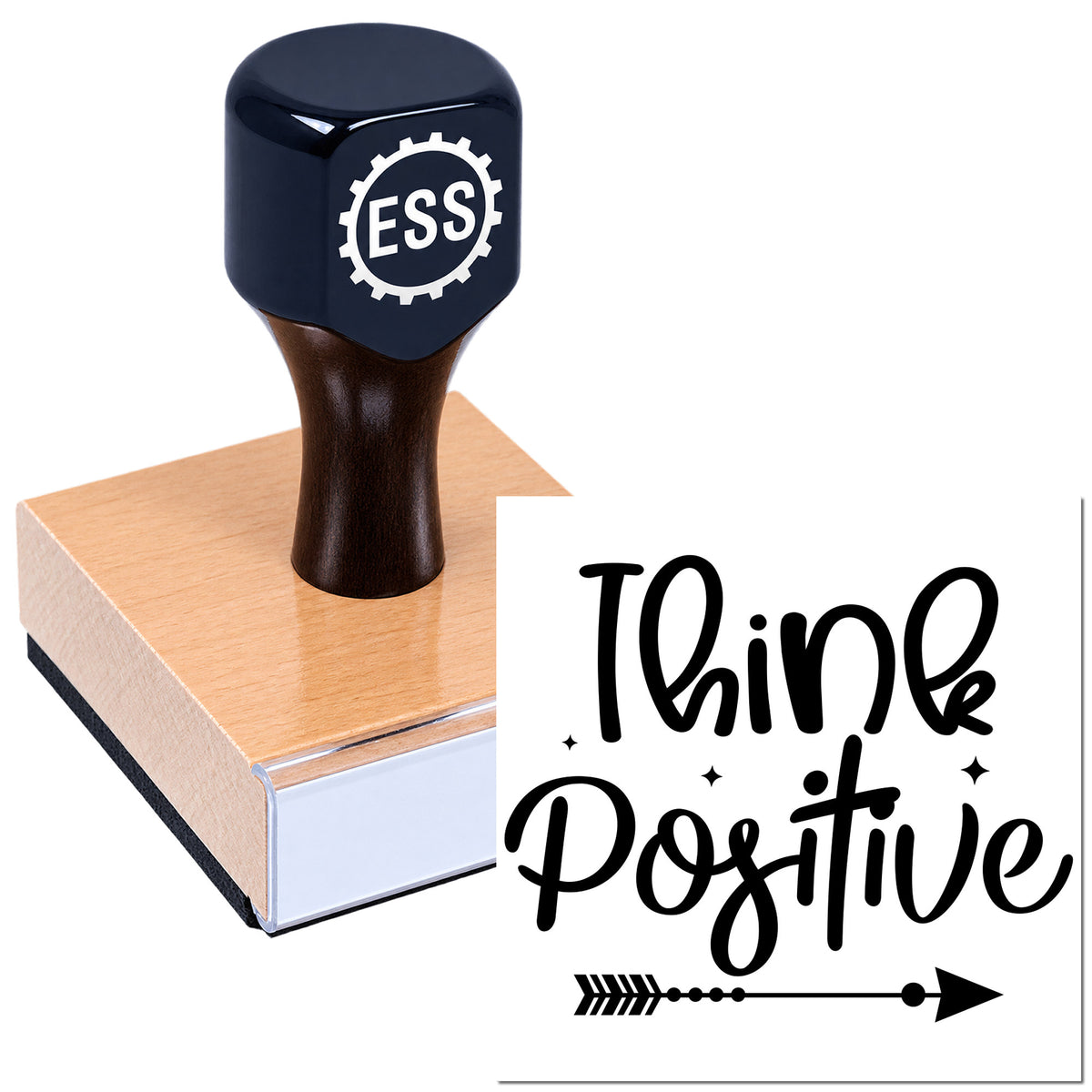 Dark blue ESS stamp and seal on pink wood block with black "Think Positive" imprint and arrow design.