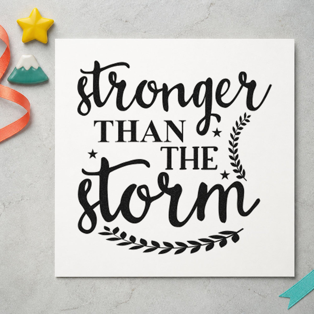 Stronger Than The Storm Leaves craft stamp imprint in black ink on a handmade project, one idea being seedling tray tags.
