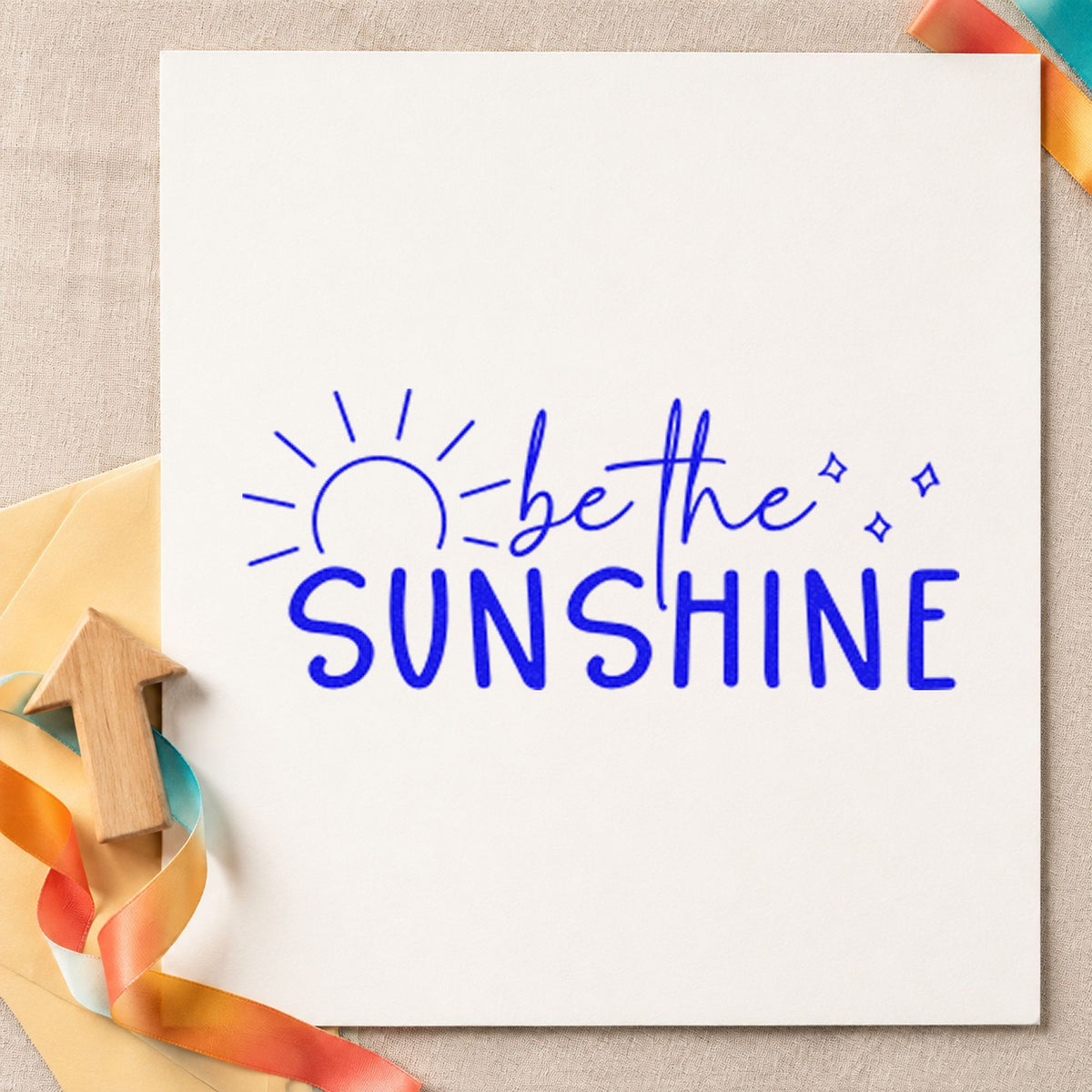 Be The Sunshine Sunrise craft stamp in blue ink on cardstock, an easy option for stand cloth printing.