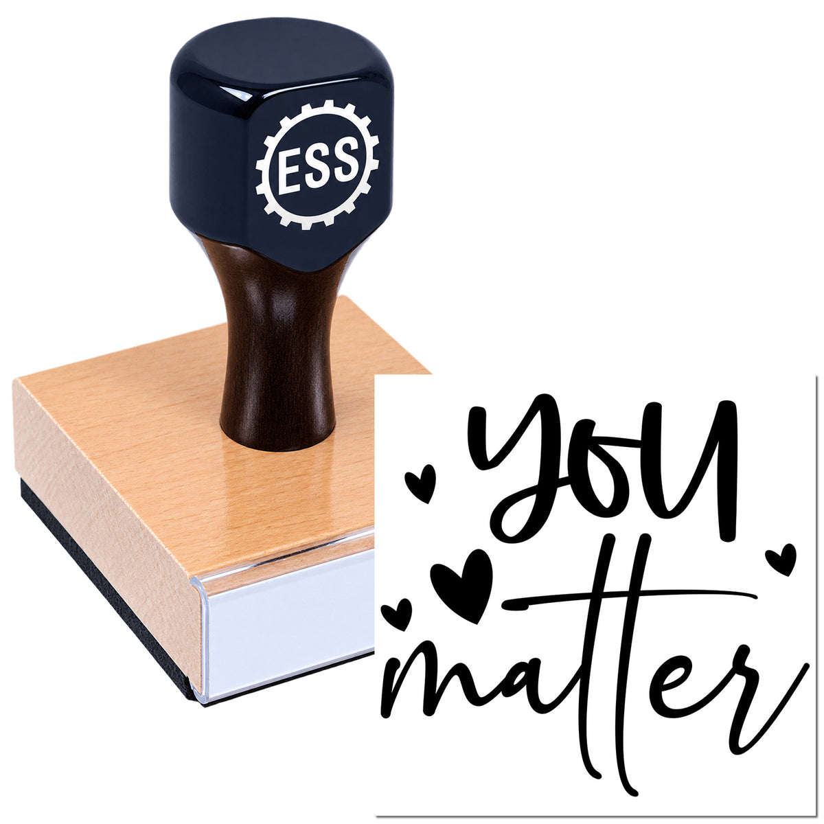 Dark navy ESS rubber stamp on pink sealing block, imprinting black "you matter" with hearts on white paper.