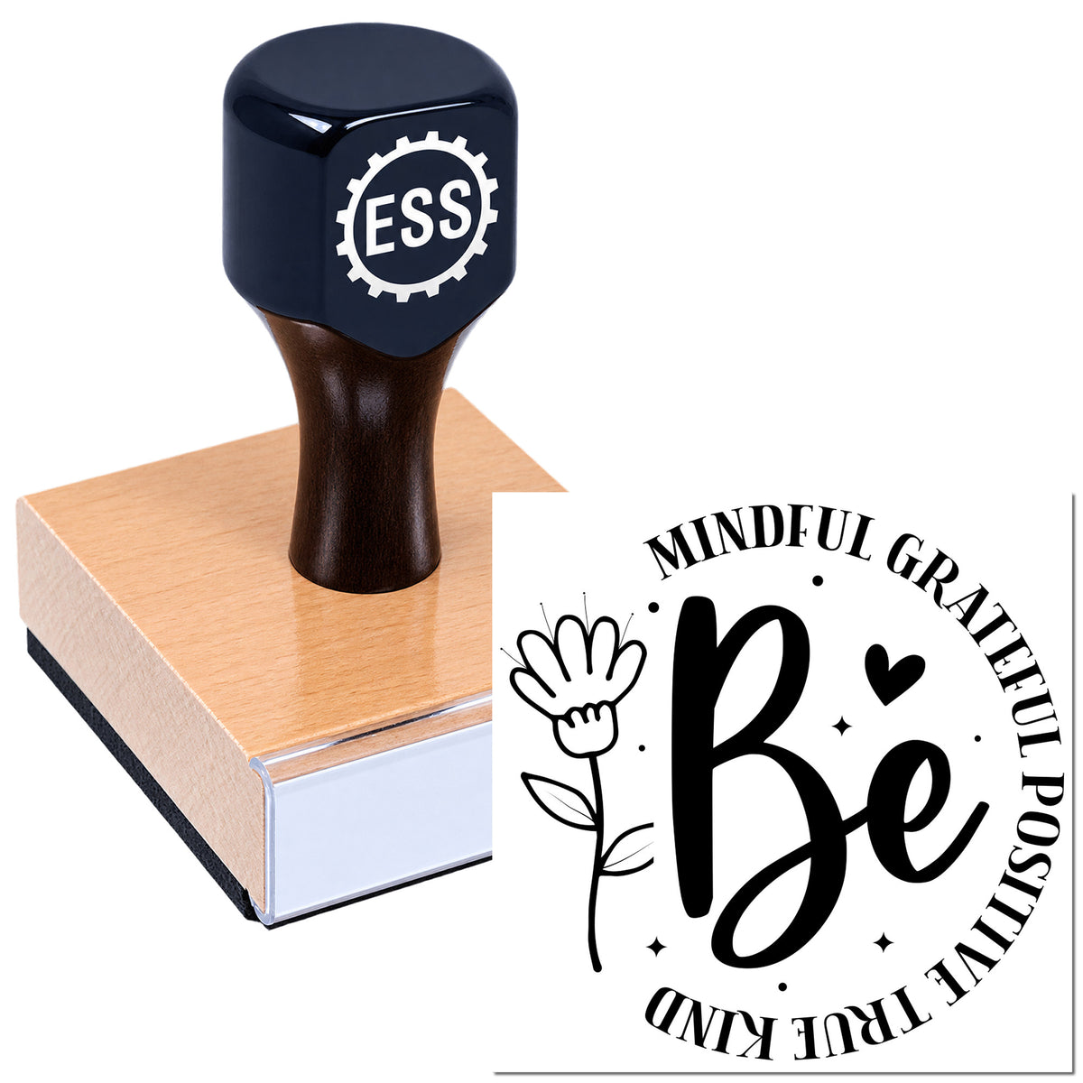 Black ESS rubber stamp on copper-pink base with black-and-white "Be Kind" seal design.