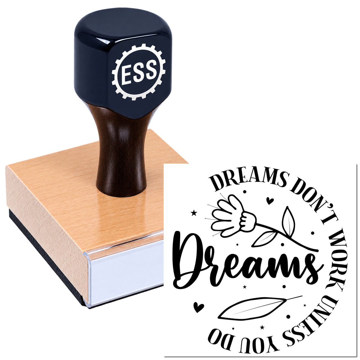 Black ESS rubber stamp on pink wooden block, showing a decorative seal design with "Dreams Don't Work Unless You Do" and a flower.